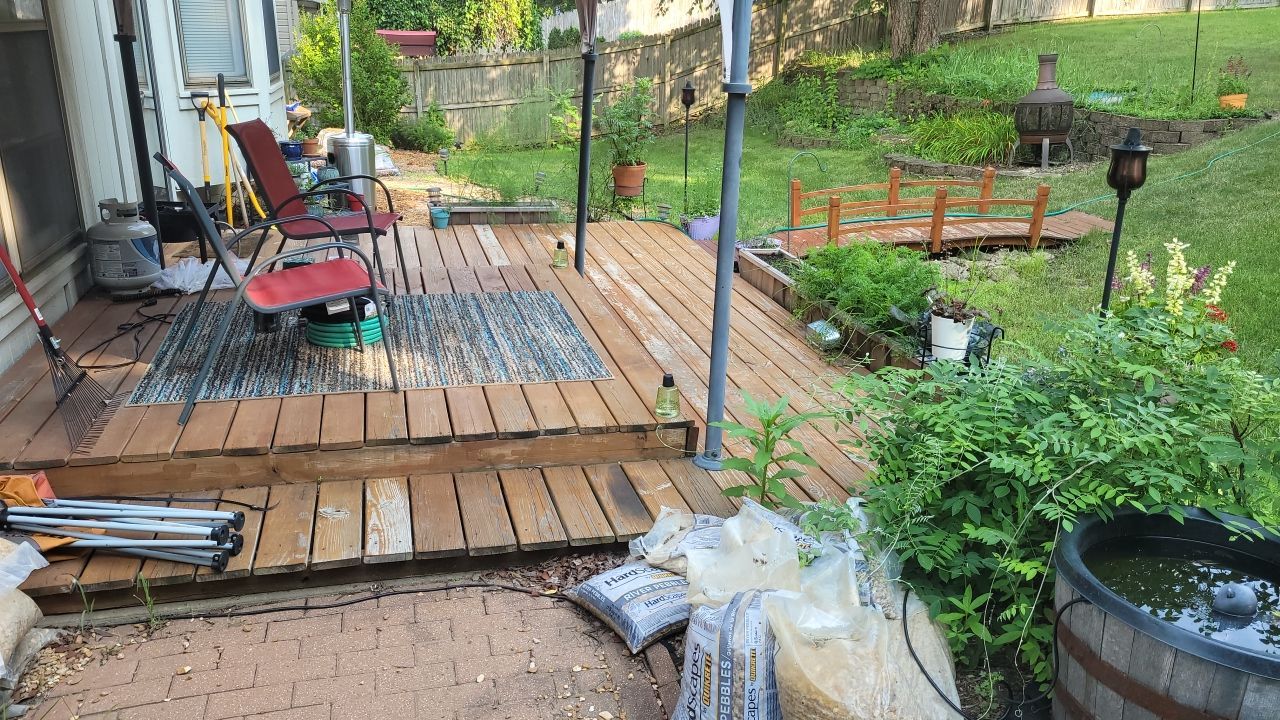 Back Yard Stamped Concrete Patio by LAND ESCAPES LLC