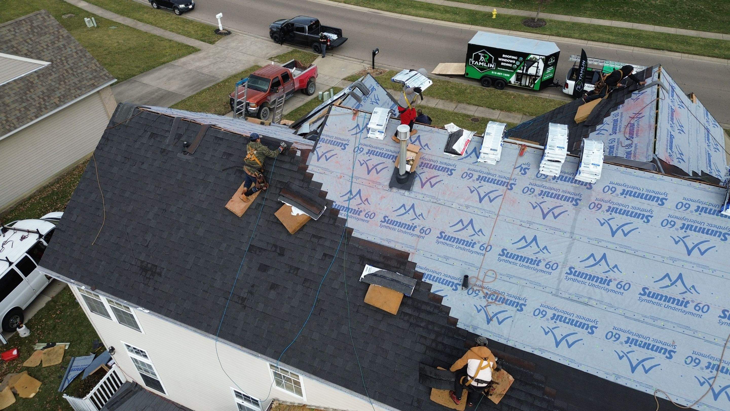 Walden Ponds - Pristine Black and Hydro Flo Gutter Guards by Tamlin Roofing