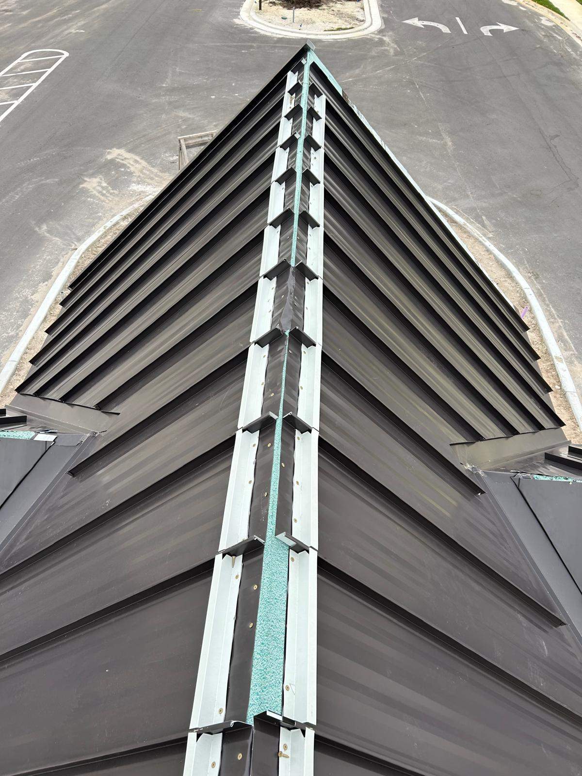 24ga 1.5" Mechanical Seam Dark Bronze by Total Roofing System The Metal Roof Experts