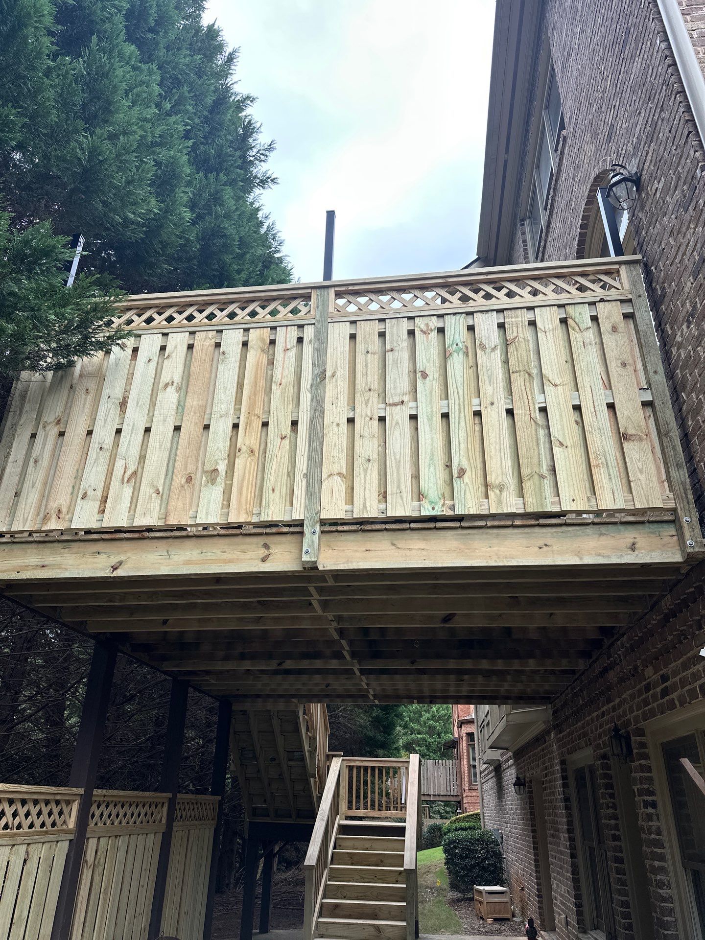 Decatur, GA Deck Resurface and Privacy Wall Build Using Pressure Treated Pine by Nelson Exteriors 
