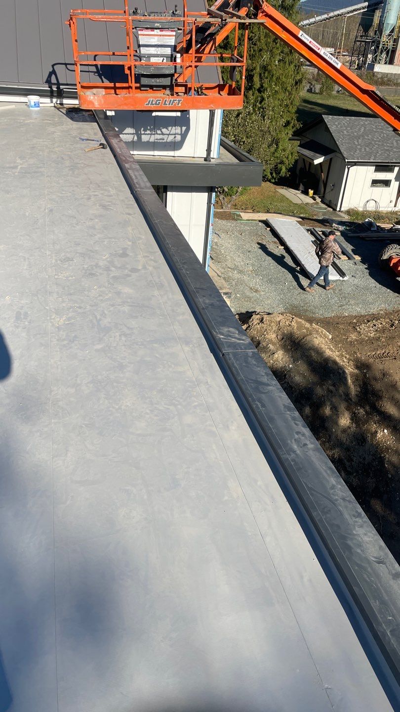 Residential Roofing Installation using multiple products by Top Notch Roofing Inc