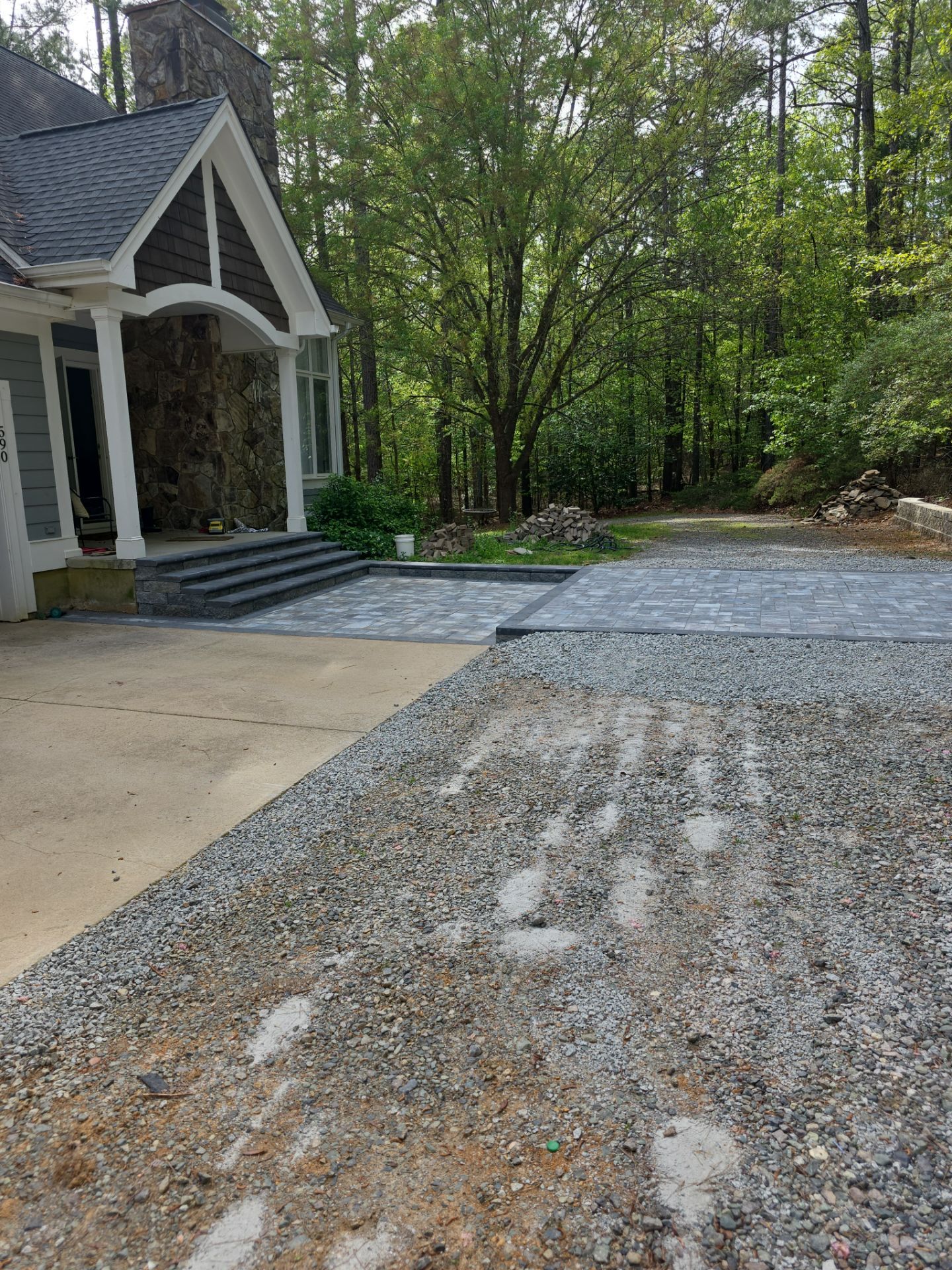 Pittsboro Outdoor Living Transformation – Retaining Wall, Paver Patio & Elevated Deck by Elite Remodeling and Design LLC
