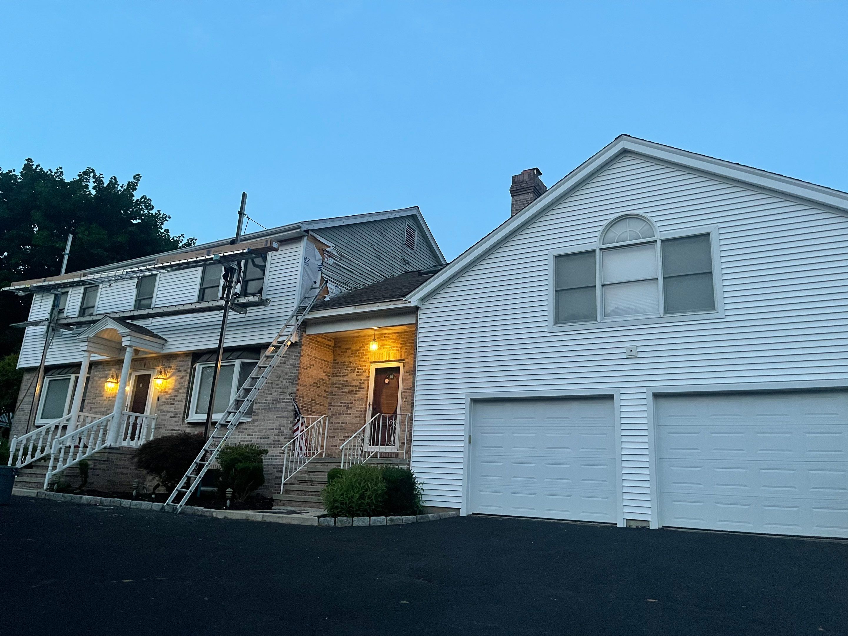 Siding Installation using Mainstreet Colonial & White gutters by A Plus Exterior