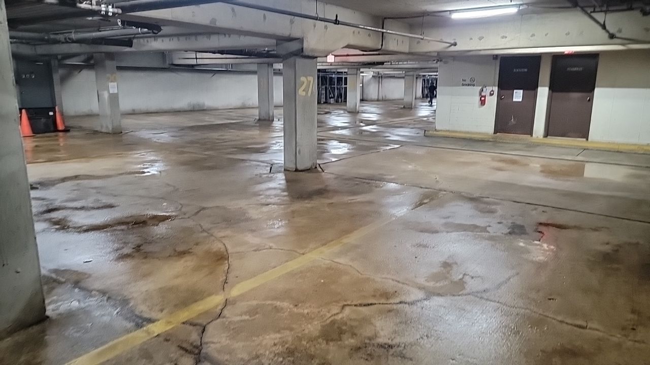 Parking garage using Hot water by Northern Power Washing LLC.