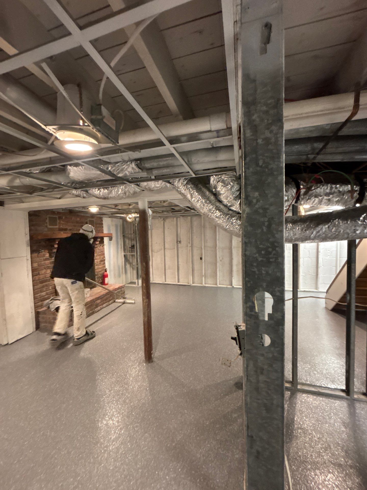 Basement Concrete Floor Coating with Penntek Flake System by Spectrum Painting, LLC