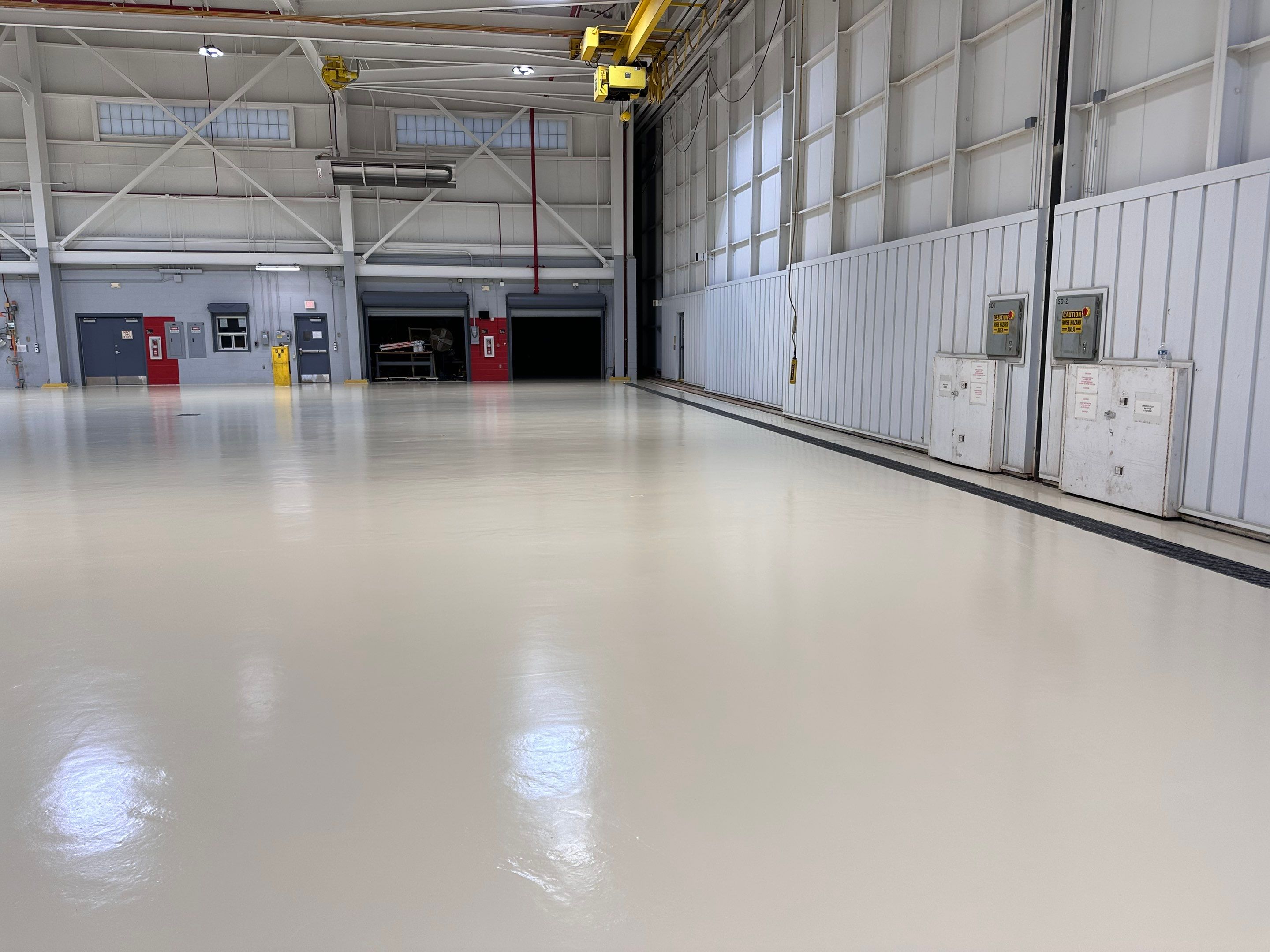 Industrial Epoxy Flooring for Army National Guard Hangar in Mobile by Cornerstone Hard Surface Restoration 