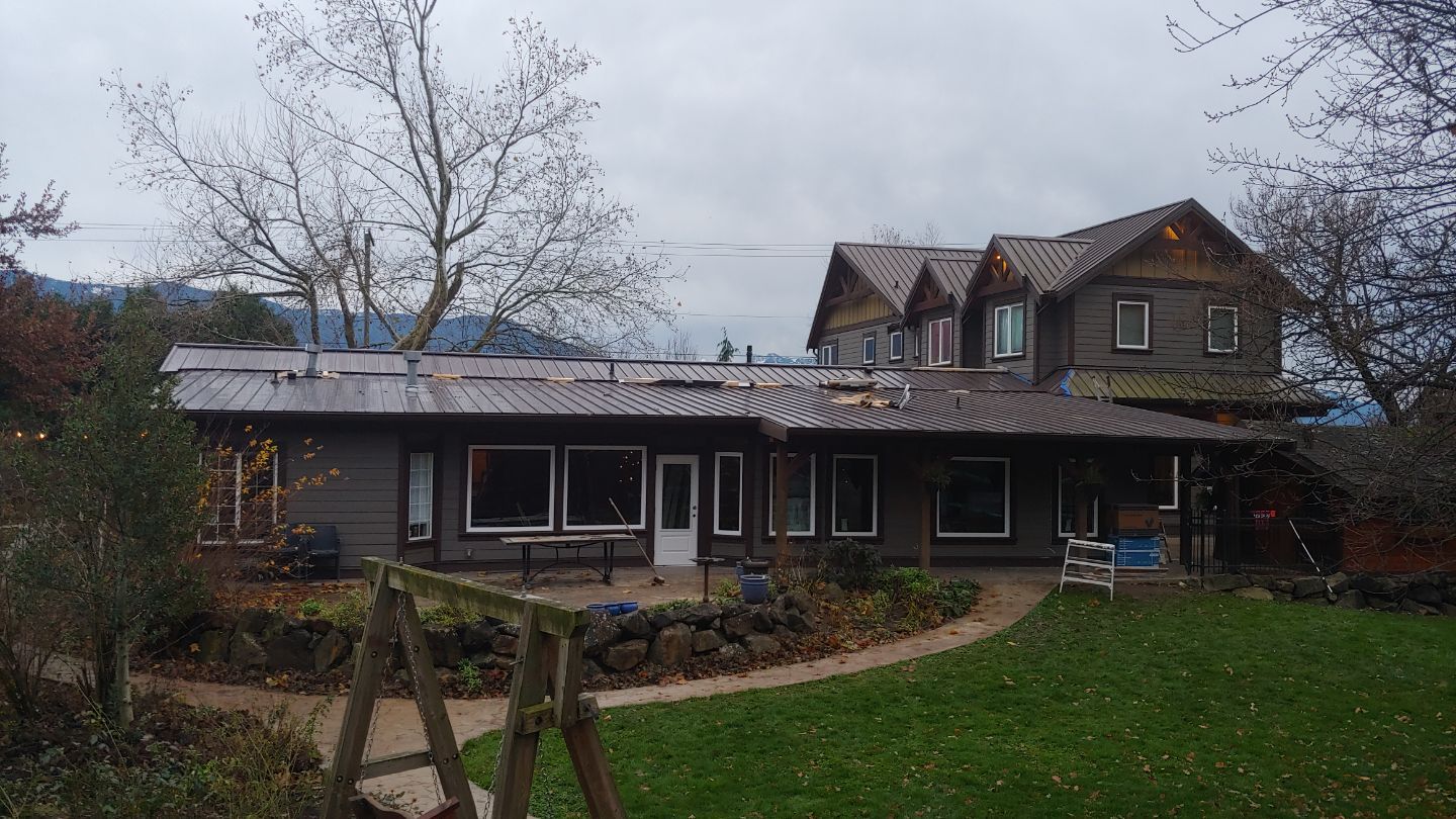 Residential Roofing Installation using 12" Prolok metal  by Top Notch Roofing Inc