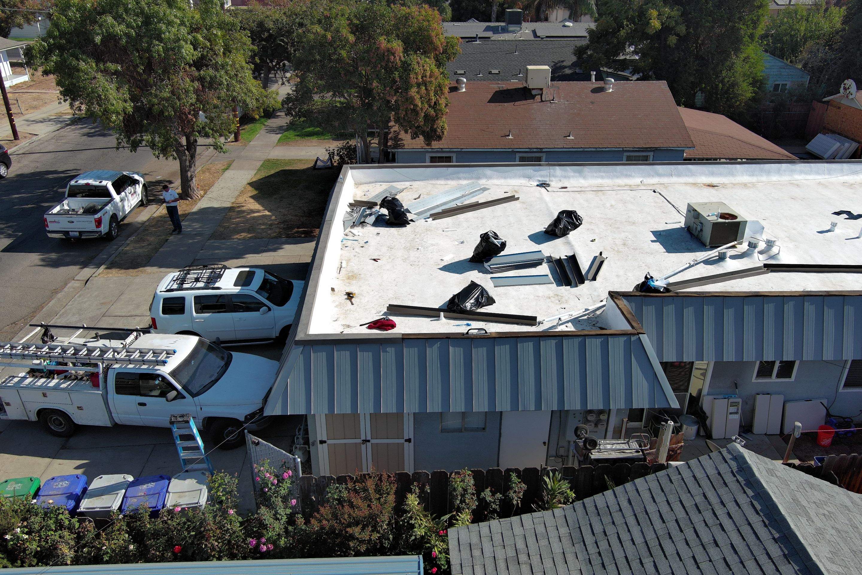 Foam Refurbish using Conklin Benchmark/PUMA XL coatings and spray foam; Also metal roofing around parapet wall by Straight Edge Roofing Inc