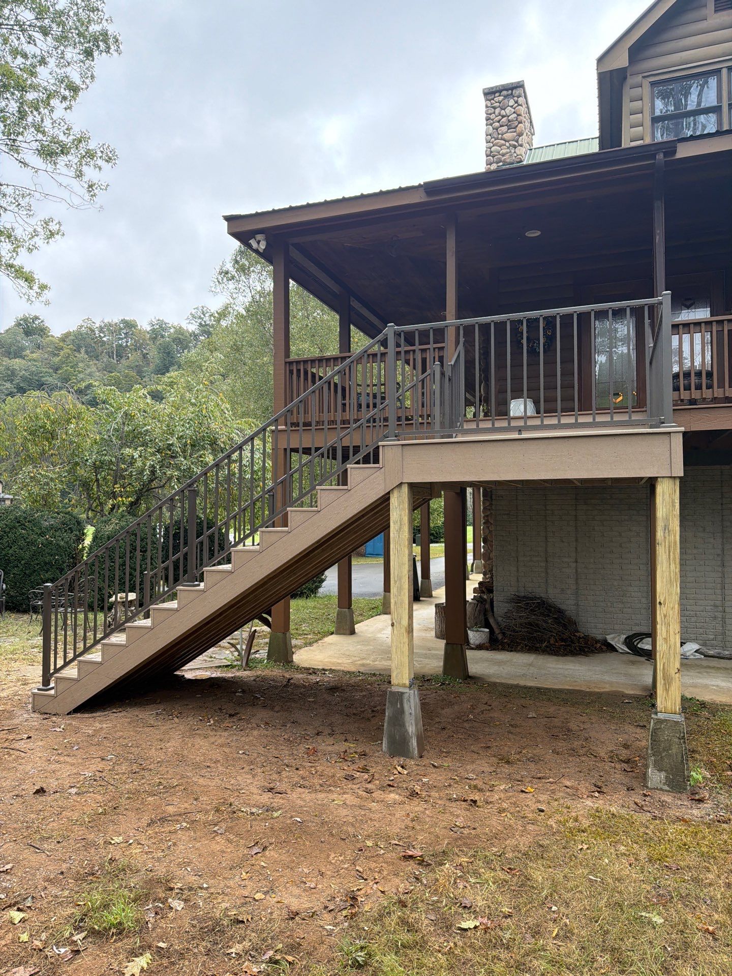 Log Cabin Wrap-Around Deck and External Staircase Installation in Caldwell by Walnut Hollow Decks & Outdoor Living
