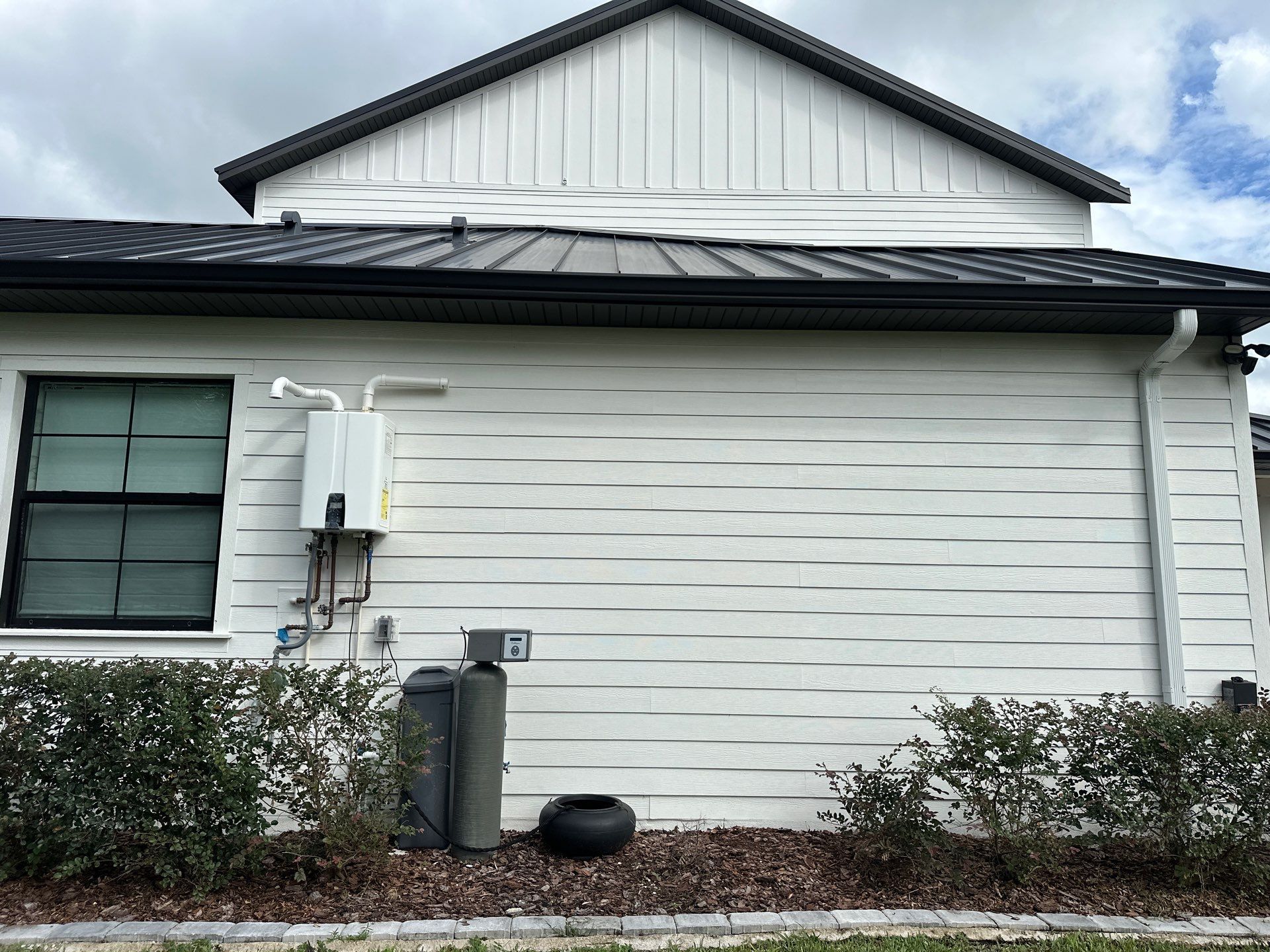 Complete Two-Story House Wash and Driveway Cleaning in Winding River Community, Bradenton, FL by Sunshine AquaWash