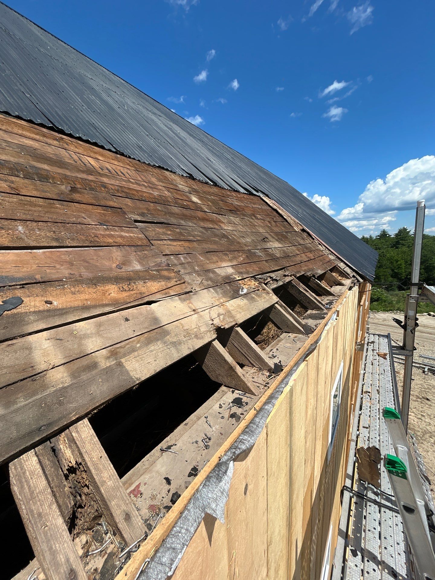 Barn Restoration and Board-and-Batten Siding Installation in Hansons Ridge by B's Roofing & Construction LLC