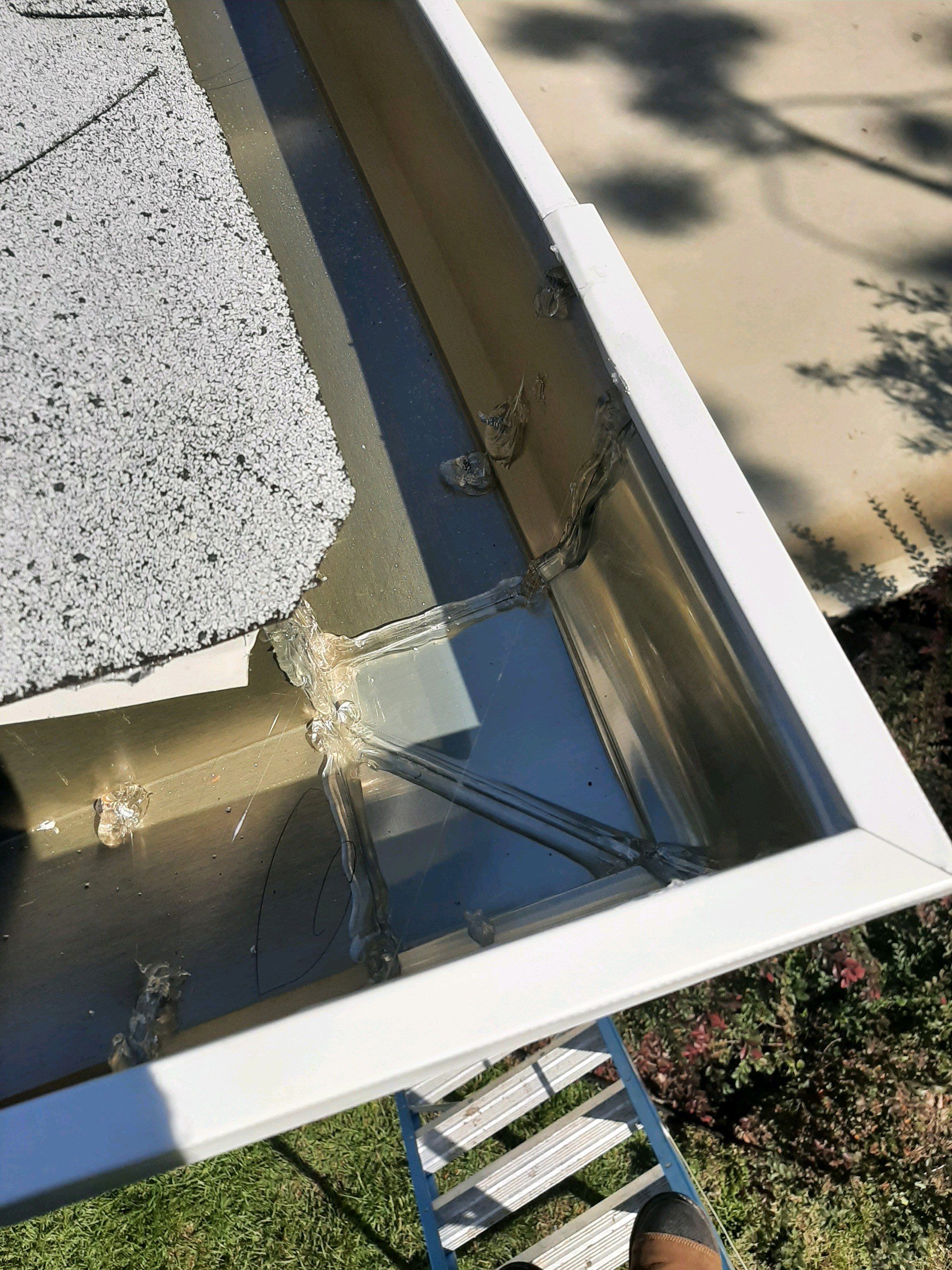 Seamless Gutter Installation using White by Gutter Professors