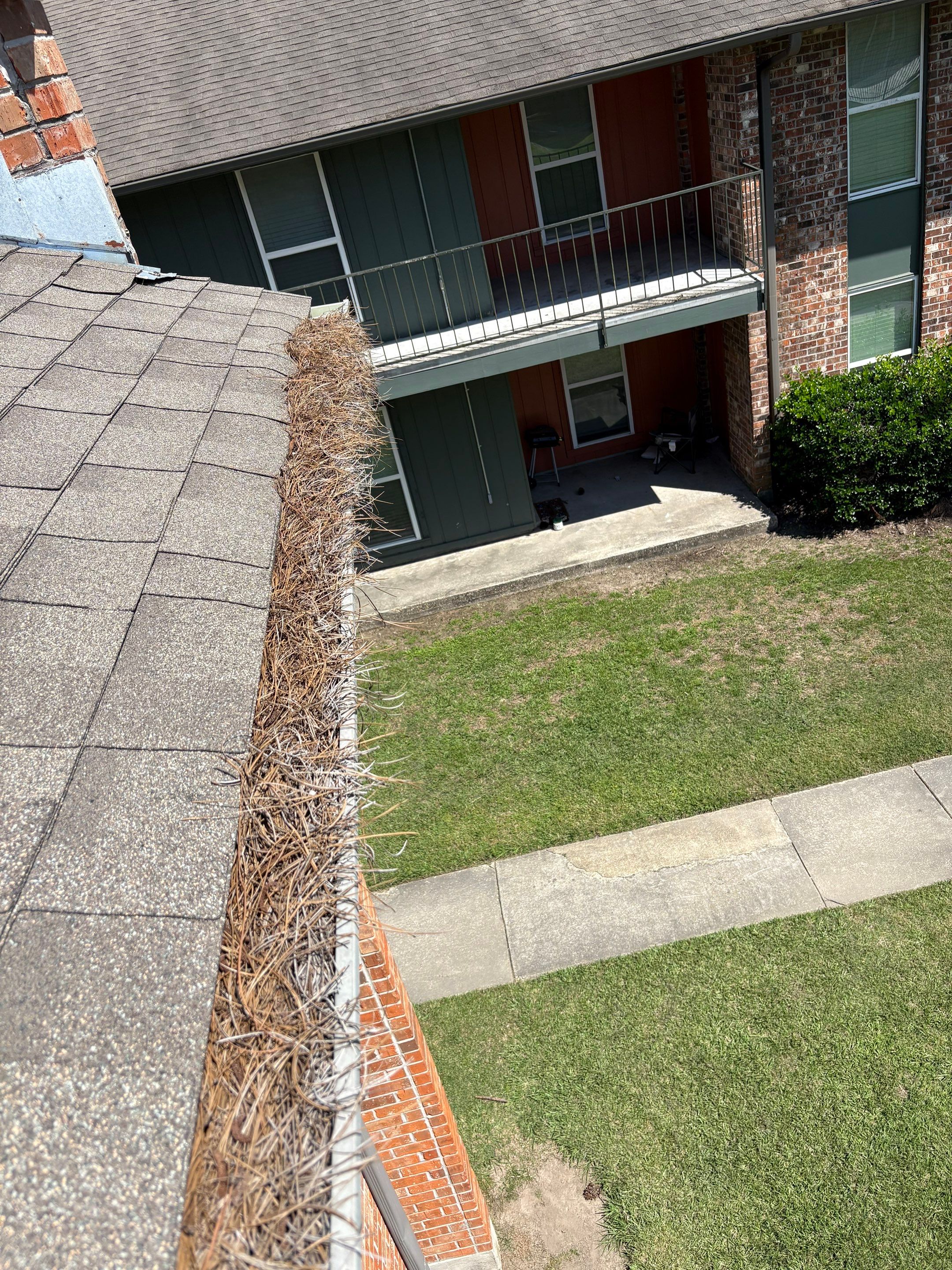 Commercial gutter cleaning Louisiana before photo with filled gutters