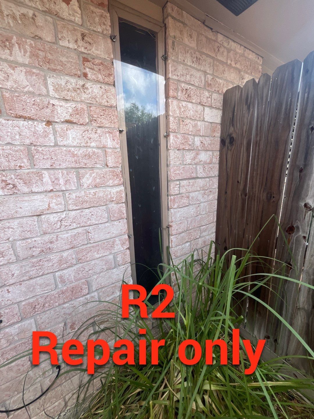 Colored Vinyl Windows to blend into brick by Bayfront Roofing and Construction