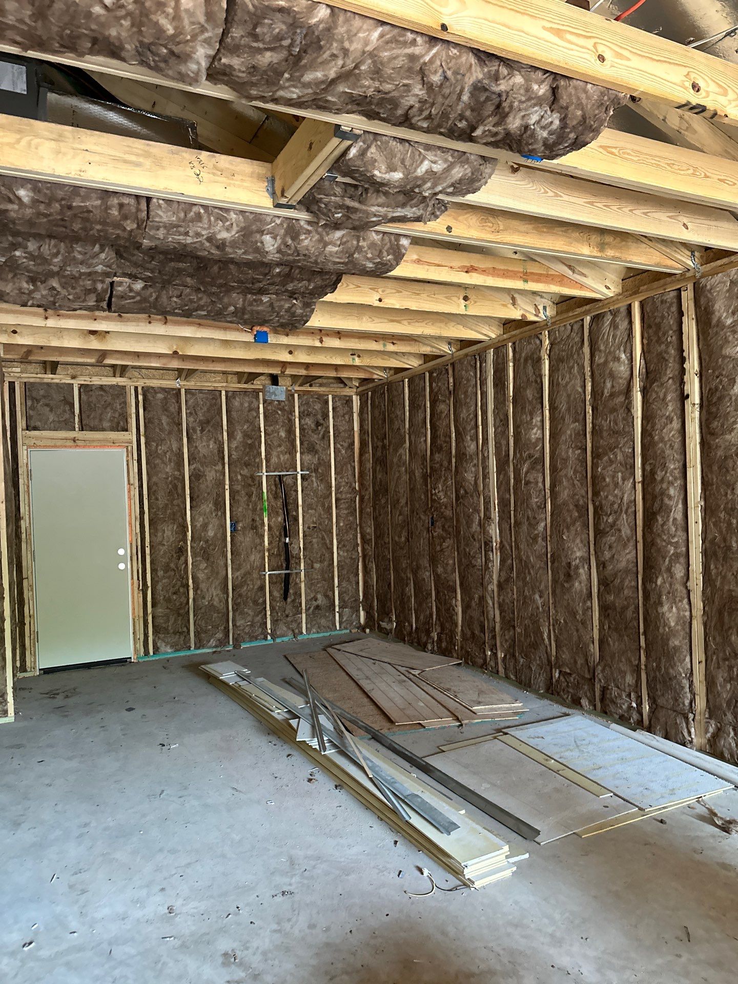 Batt install on Dallas home garage addition with a living suite.  by Apex Insulation Solutions