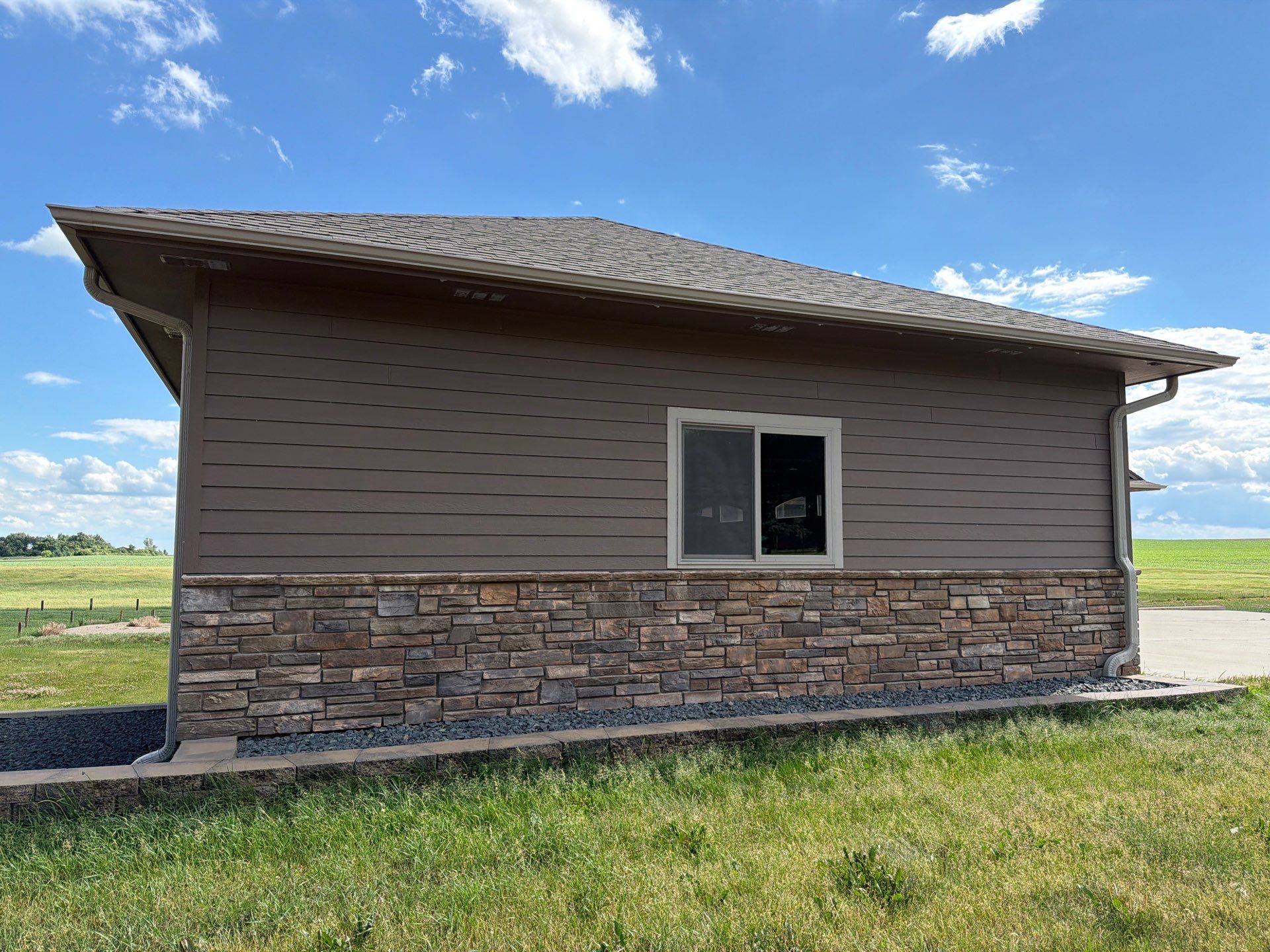 Full Exterior Siding Paint Restoration and Refresh in Garretson by Select Painting, Coatings & Garage Cabinets