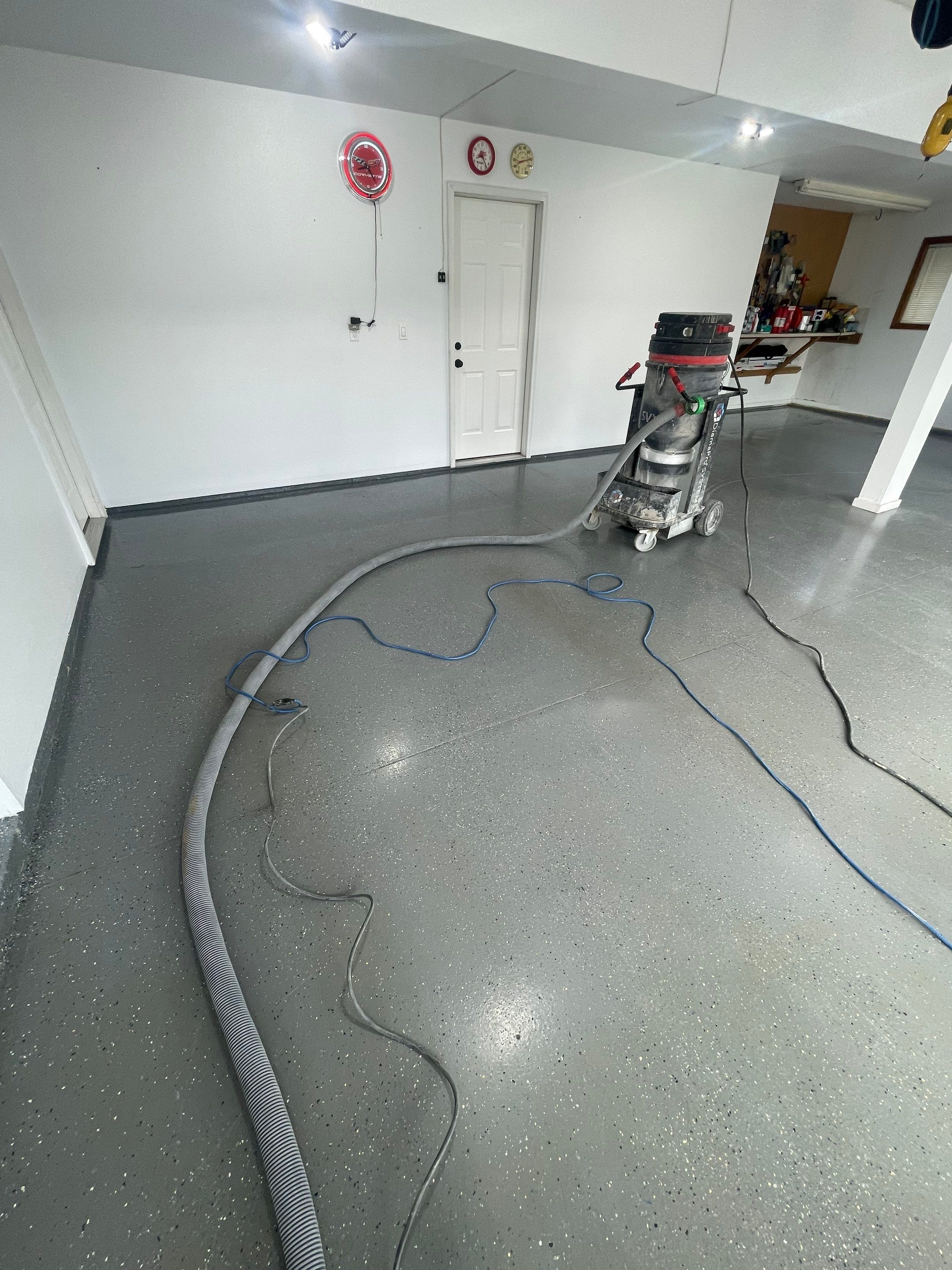 Multi-Car Garage Concrete Coating with Coyote Flake Finish in Sioux Falls by Select Painting, Coatings & Garage Cabinets