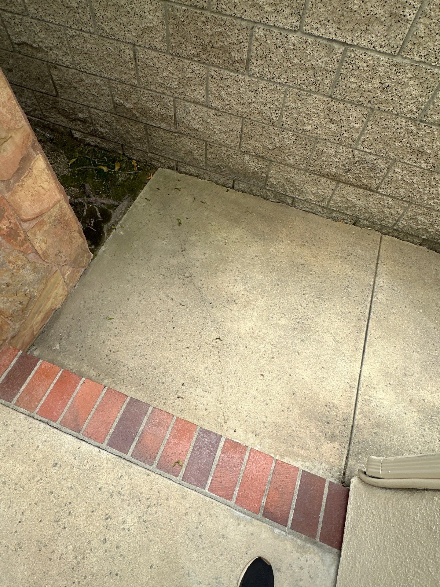 Surface cleaning pressure washing in Orange County on patio, walkways, and driveway by Property Cleaning Experts, LLC