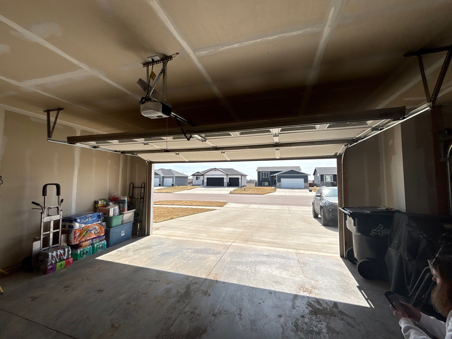 Grey Flake Epoxy Garage Floor Coating in Sioux Falls by Select Painting, Coatings & Garage Cabinets