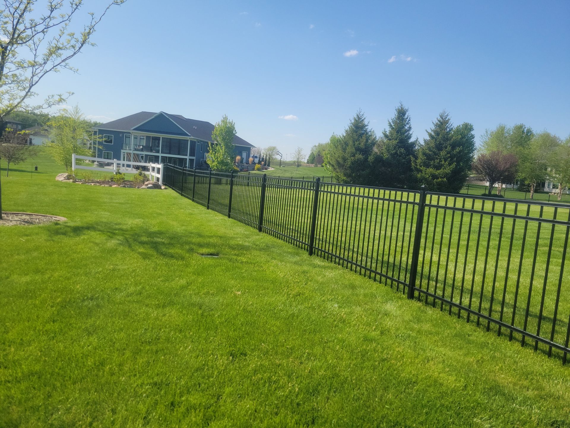 Black Ornamental Metal Picket Fence Installation in Waterloo by Perfect Picket Fence and Stain
