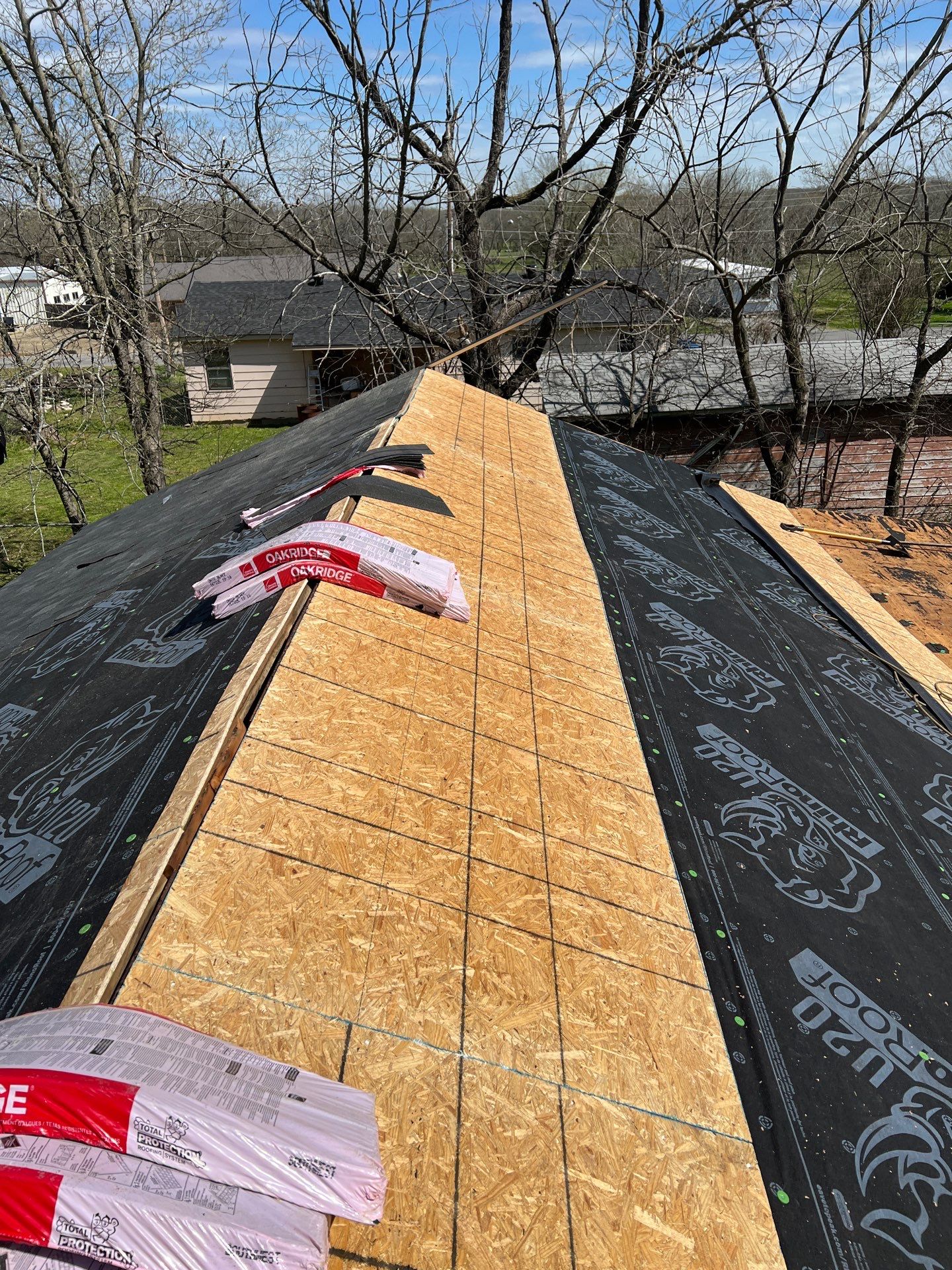 New Roof & Decking Brought to Code. by In & Out Construction & Remodeling, LLC