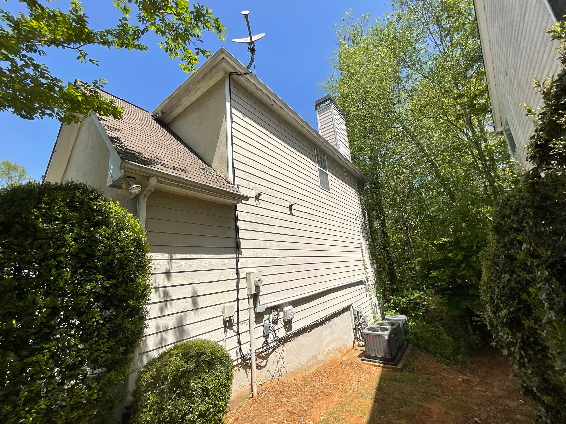 Stucco and Siding Exterior Painting with New Gutters in Kennesaw by Swift Home Renovations