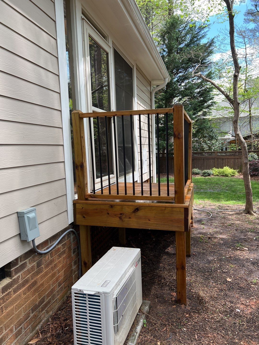 Deck and Stamped Concrete Patio by DuraSeal
