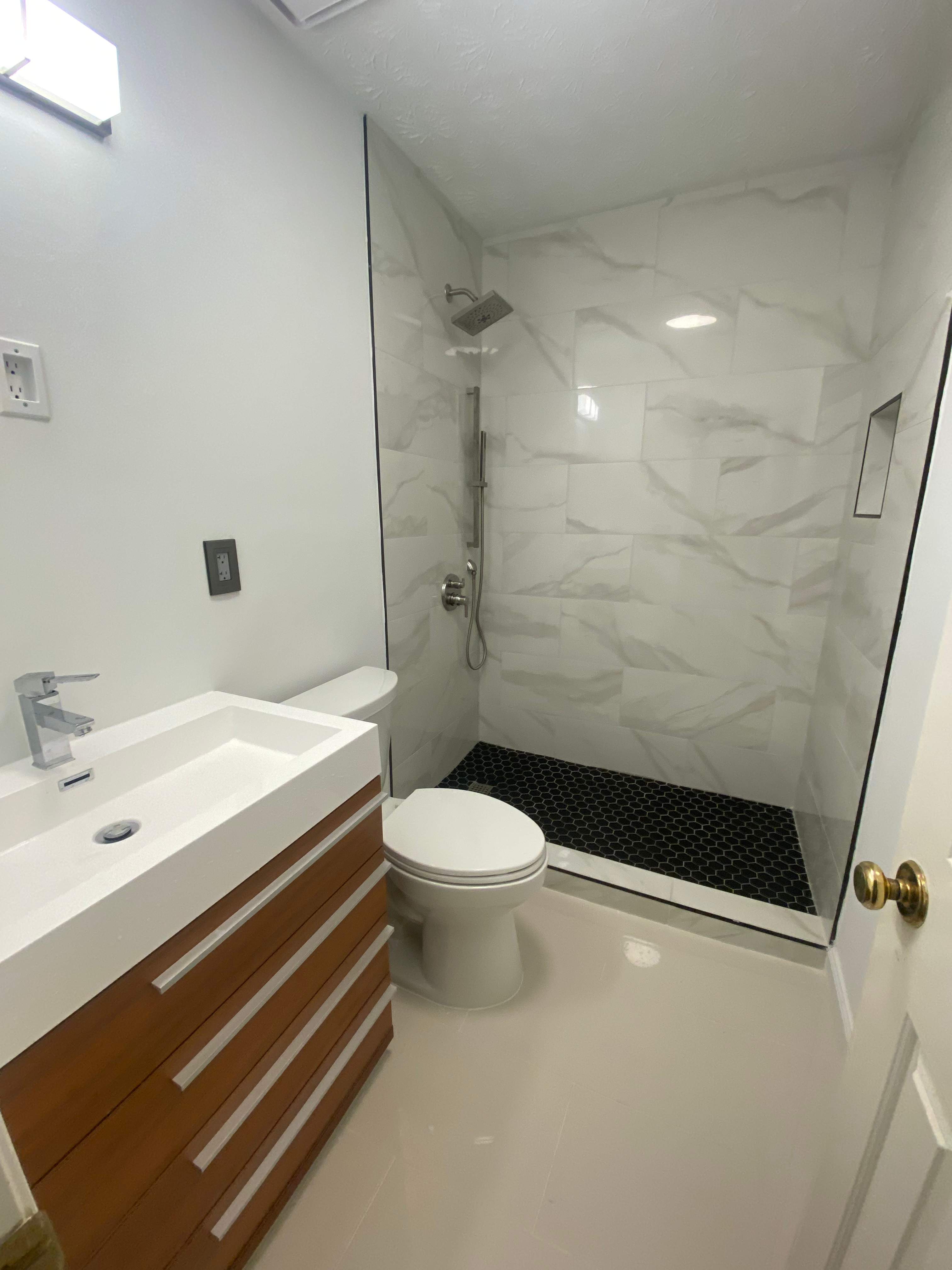 Tub to walk-in shower conversion by Prudencio