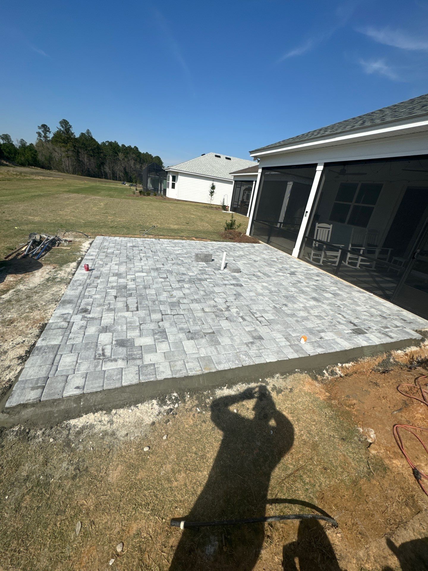 Custom Grey Paver Patio and Square Fire Pit in Hardeeville by Lowcountry Scapes, LLC