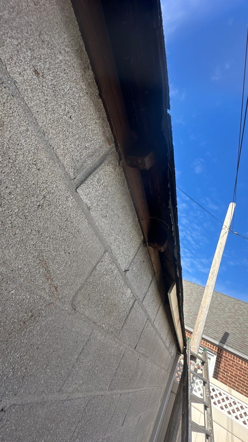 Queens Garage Fascia Rebuild + New 5" Seamless Gutter by Above All Gutters