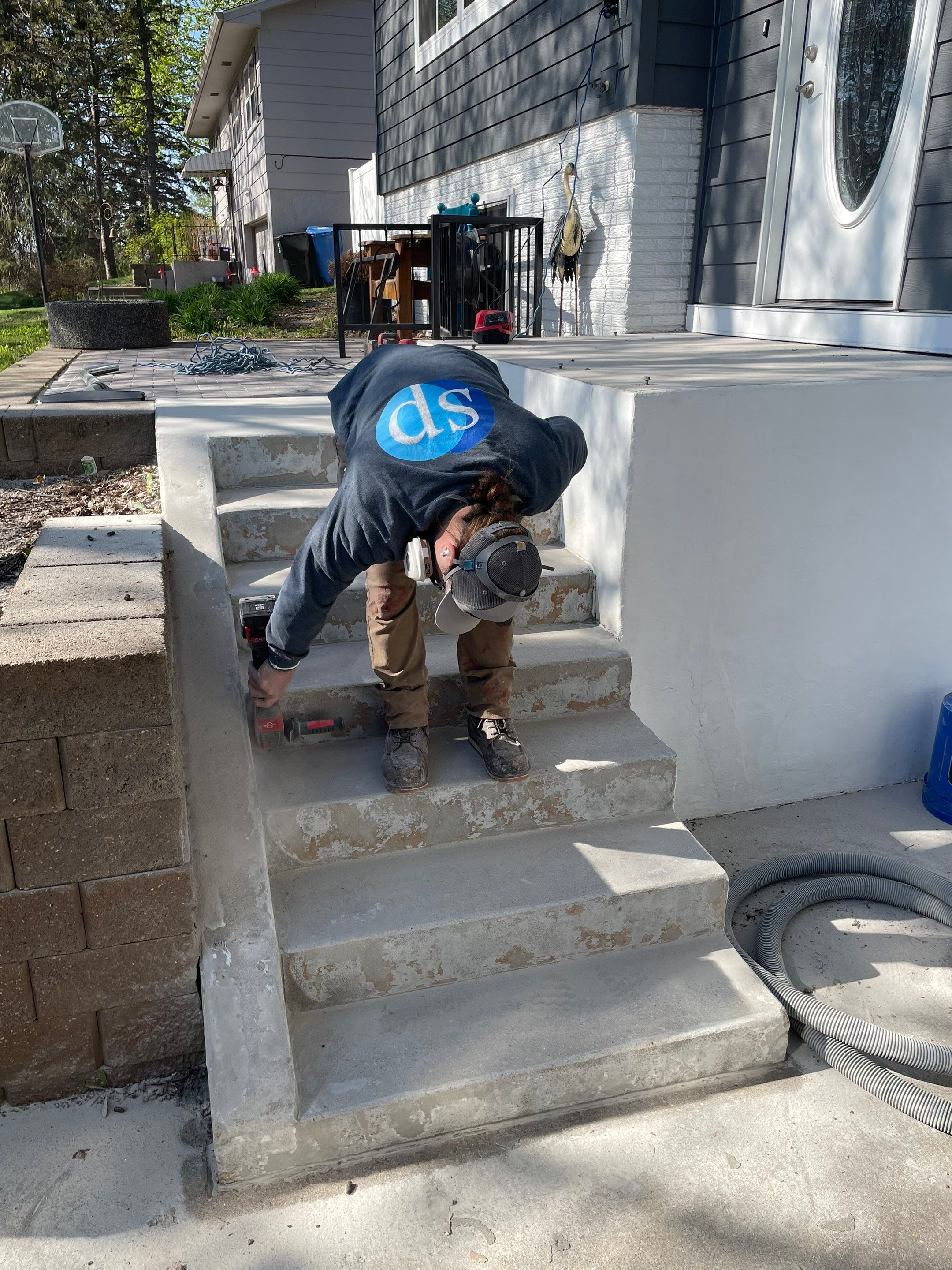 Grey Polyaspartic Porch and Stair Resurfacing in Sioux Falls by Select Painting, Coatings & Garage Cabinets