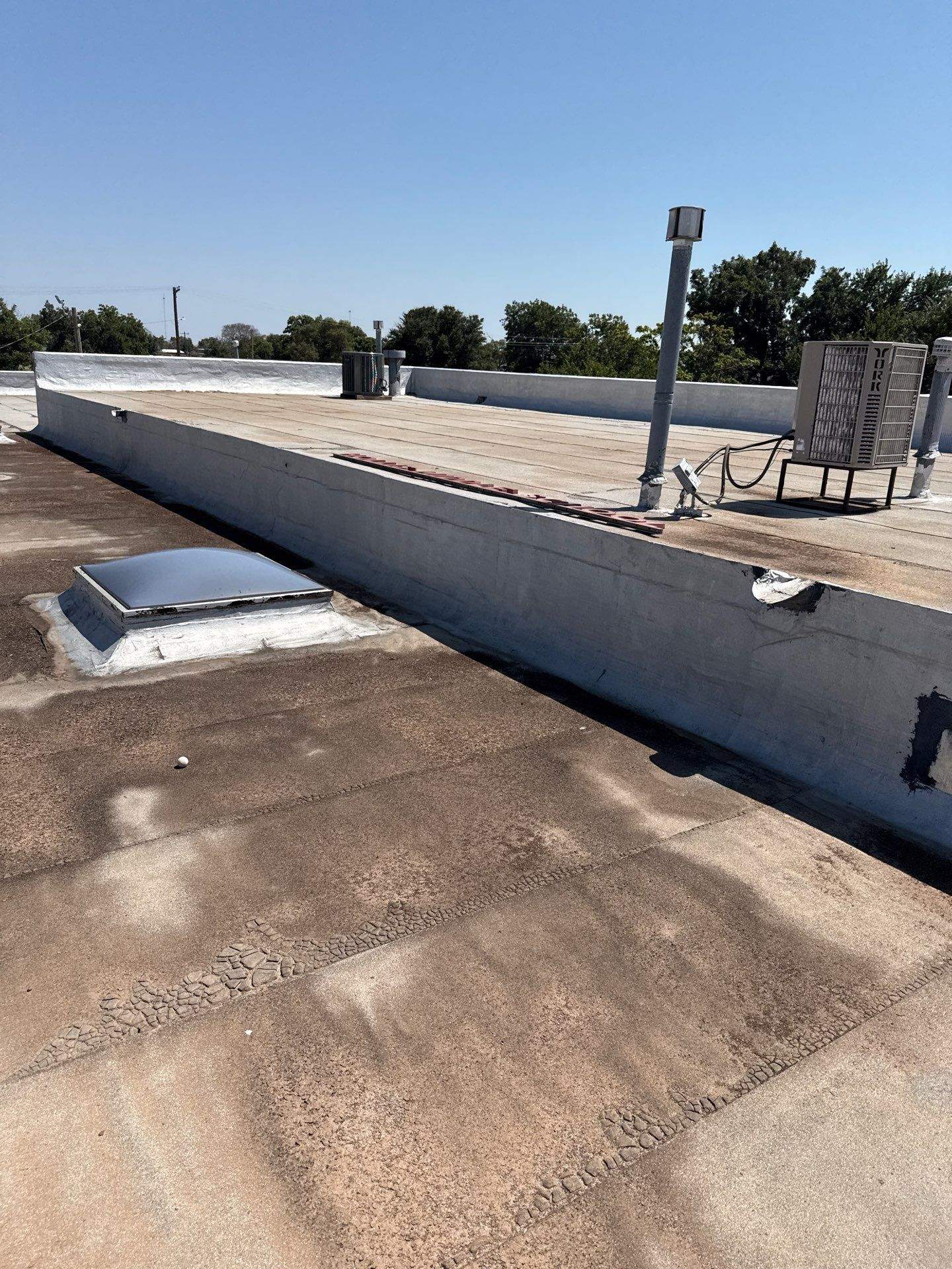 Hollis High School Comprehensive TPO Roof Replacement and Restoration by Secondary Rhodes