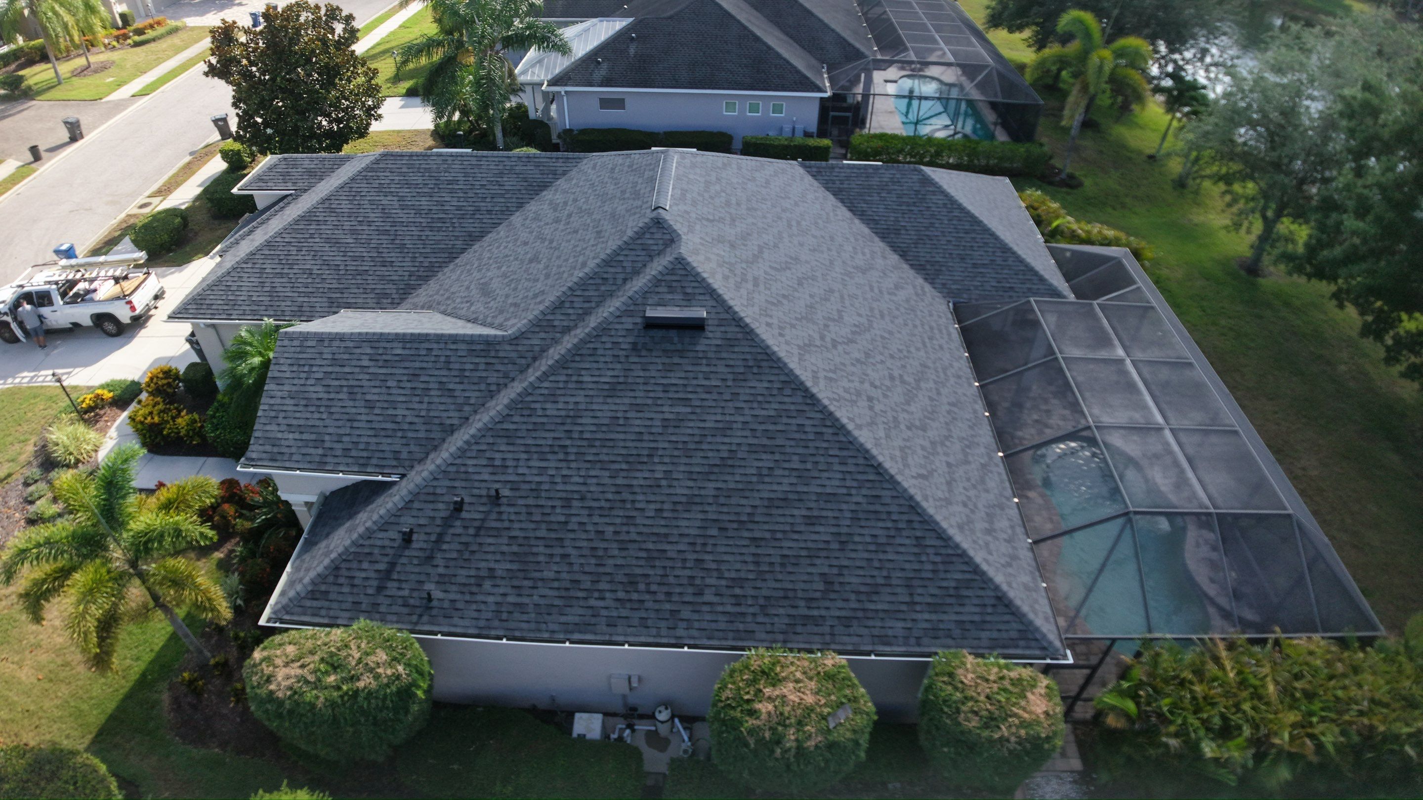 Residential Roof Installation With Estate Grey Architectural Shingles in Bradenton by Trinity Restoration and Roofing LLC