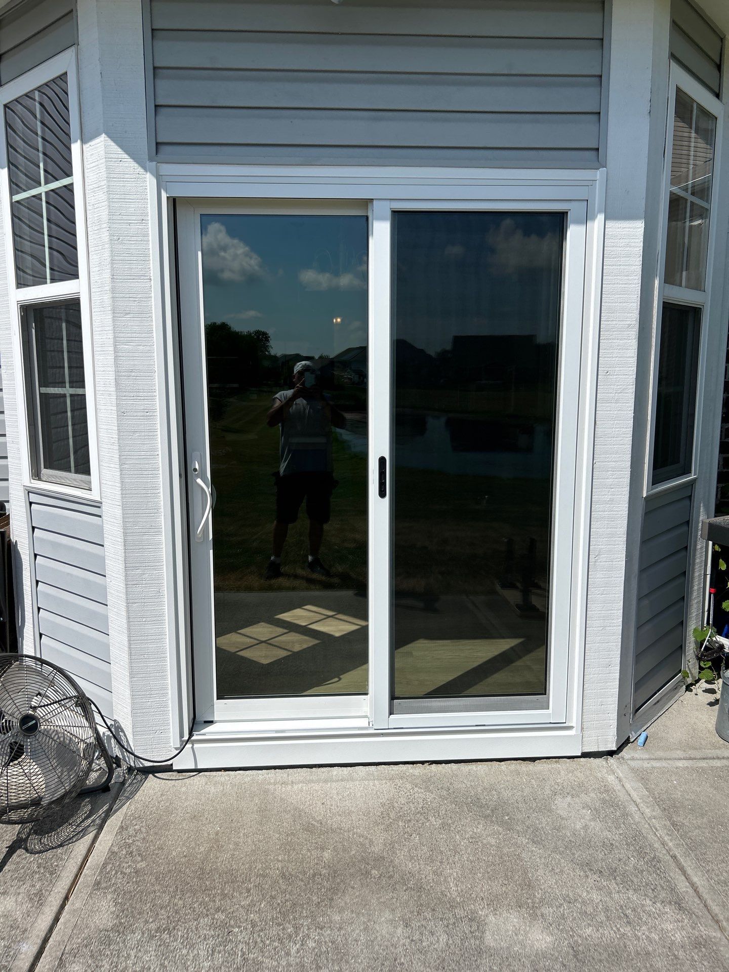 White Vinyl Sliding Patio Door Replacement in McCordsville by Merrifield Exteriors, LLC