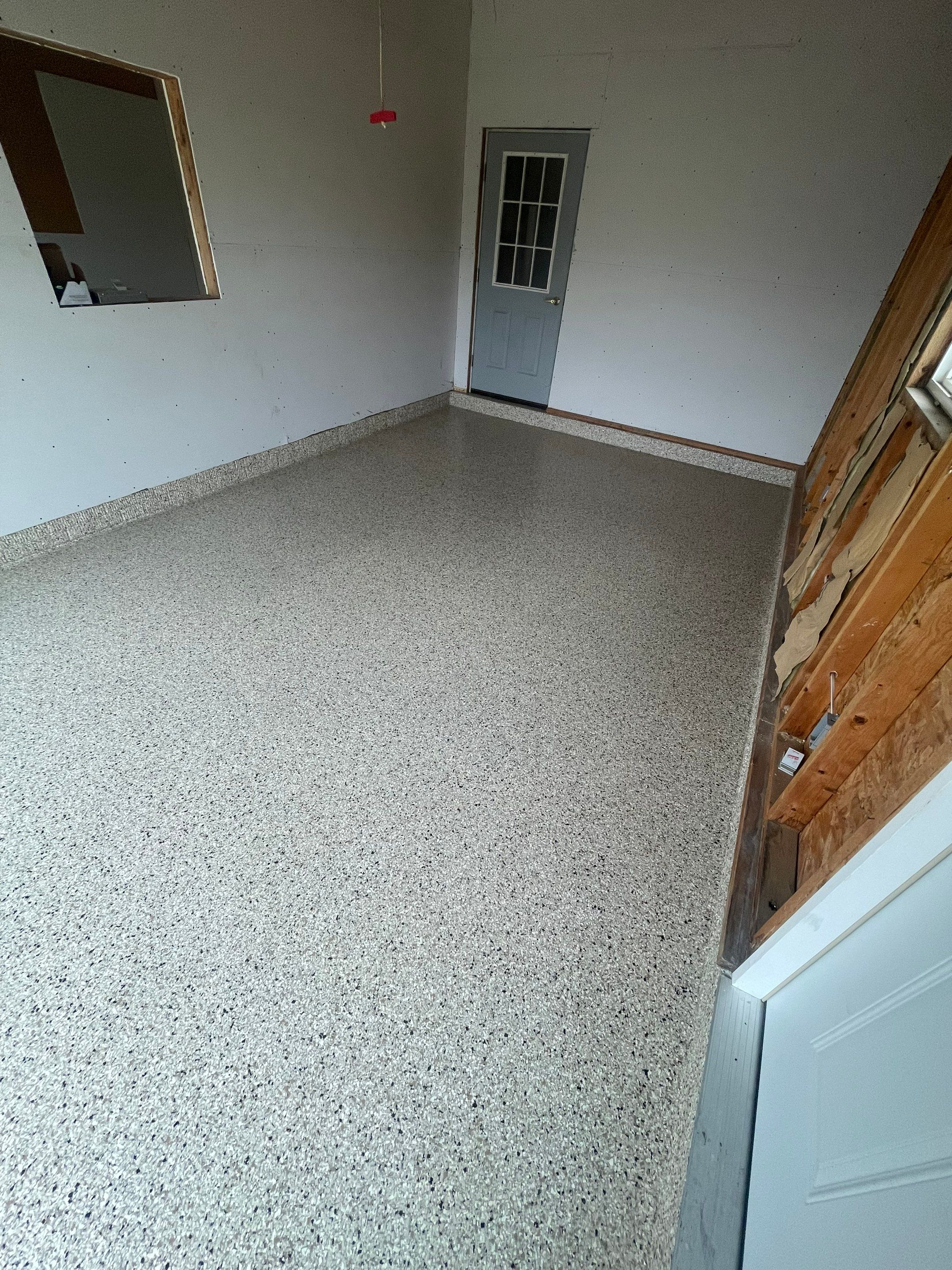 Speckled Epoxy Floor Coating Installation for Centerville Residential Garage by Select Painting, Coatings & Garage Cabinets