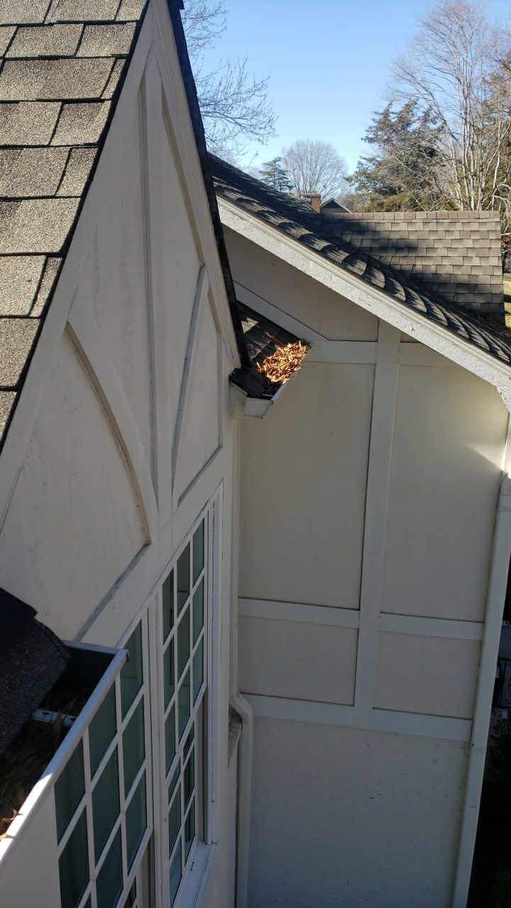 Sara Gutter cleanout using water by Power Wash Masters LLC