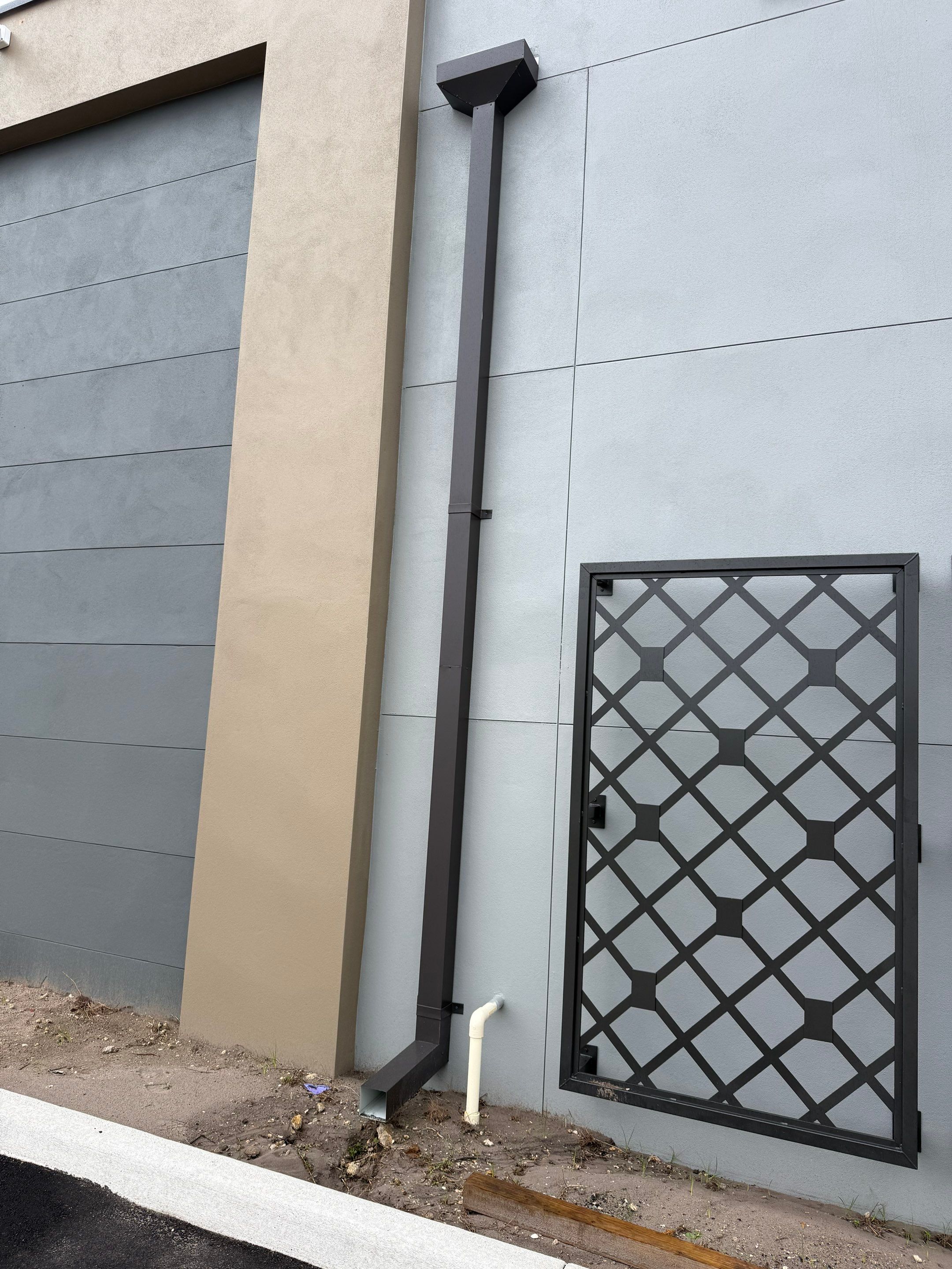 Downspout Installation using collector head in Cape Coral FL by Gutter Professors