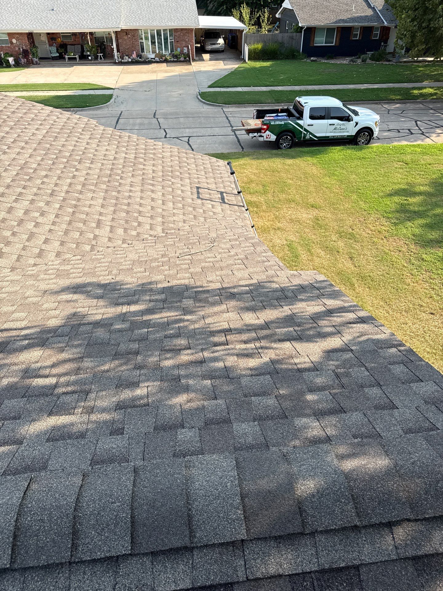 roof replacement, and chimney flashing replacement in Norman by McCann's Roofing and Construction