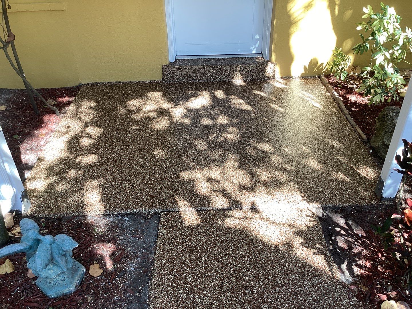 Sidewalks and Porches using Chestnut by Amvet concrete coatings llc