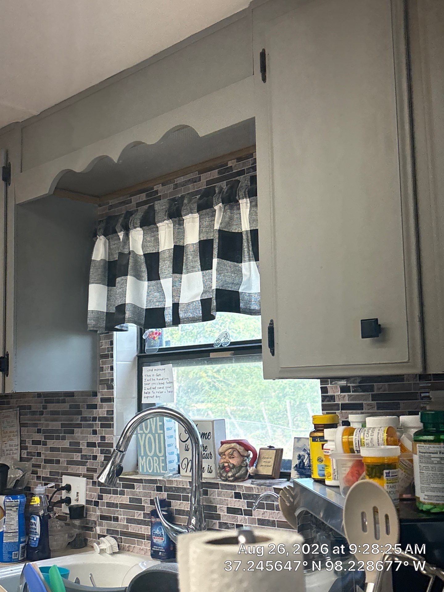 Modernized Kitchen with Gray Painted Cabinets and Tile Backsplash by CompanyCam Sales Demo