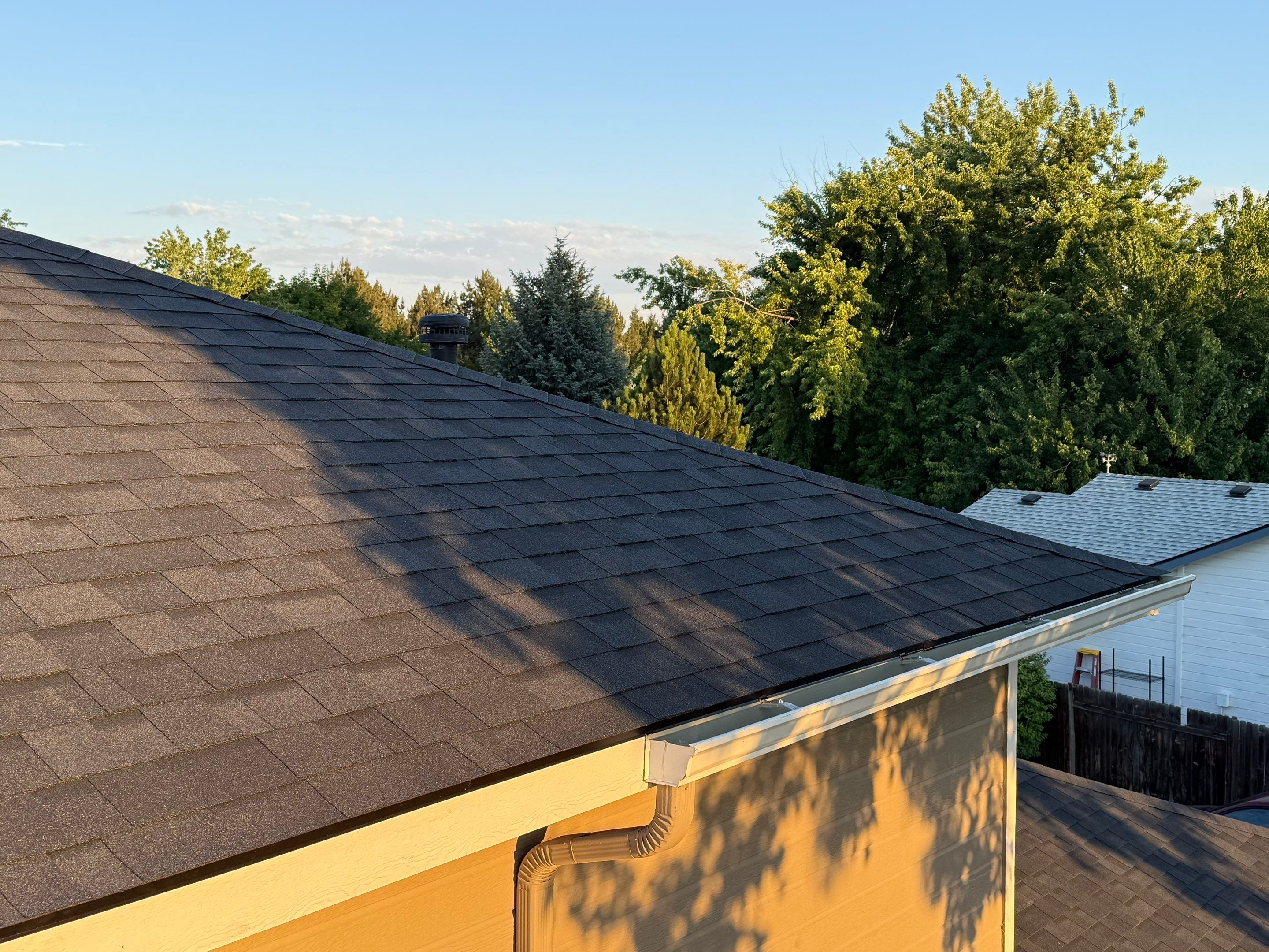 Residential Roof Replacement and Seamless Gutter Installation in Boise by Olive Roofing