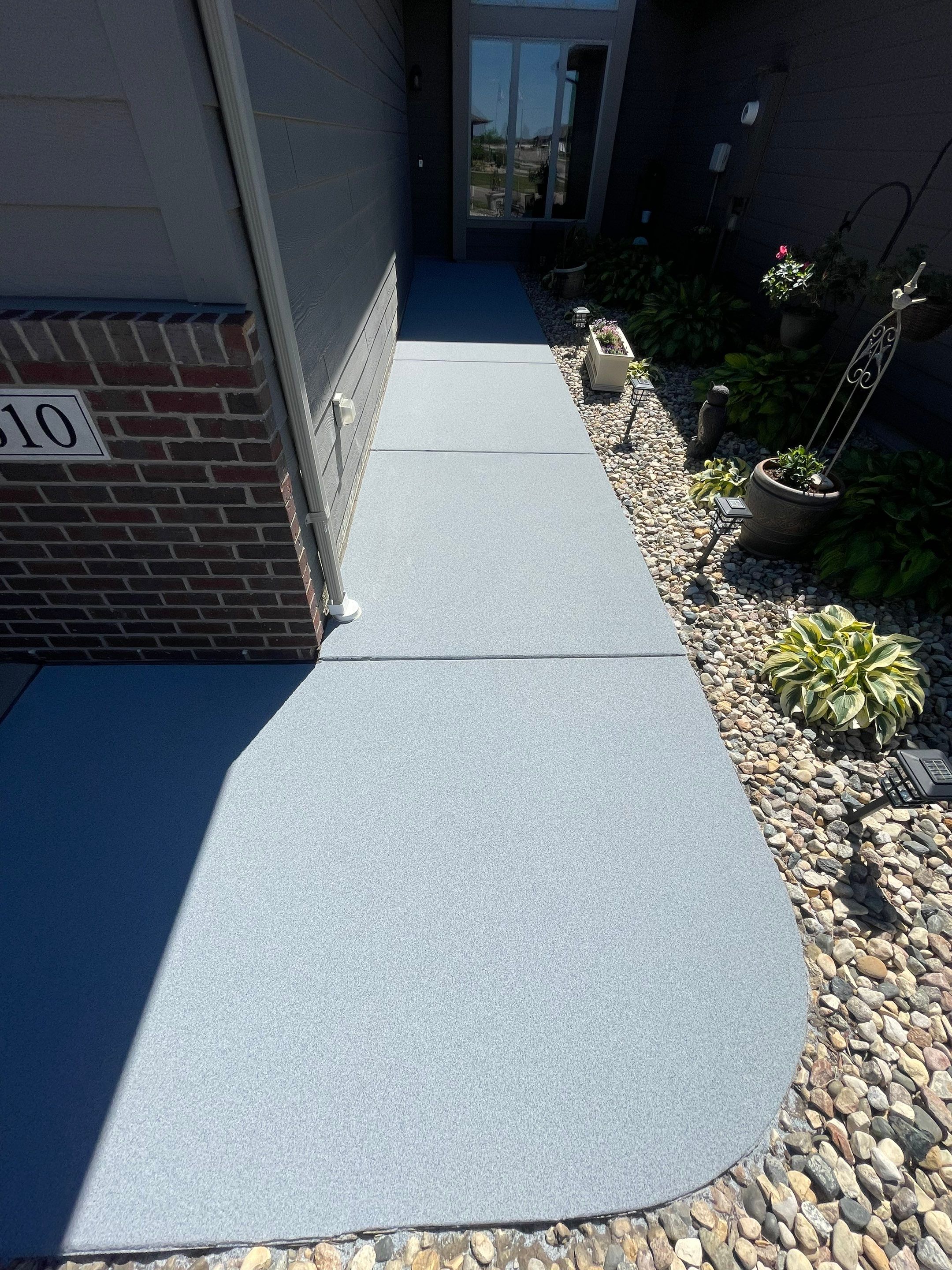Custom Concrete Coating for Sioux Falls Patio and Front Walkway by Select Painting, Coatings & Garage Cabinets