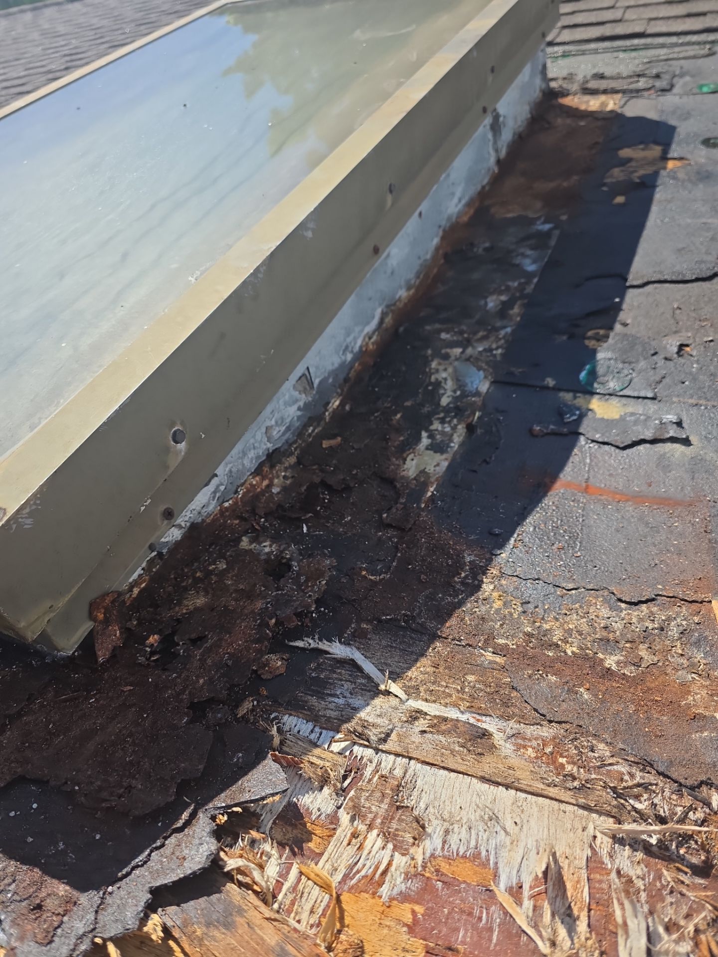 REPLACE NON APPROVED SKYLIGHT ALONG WITH CLOGED GUTTER by Morton Roofing, Inc.