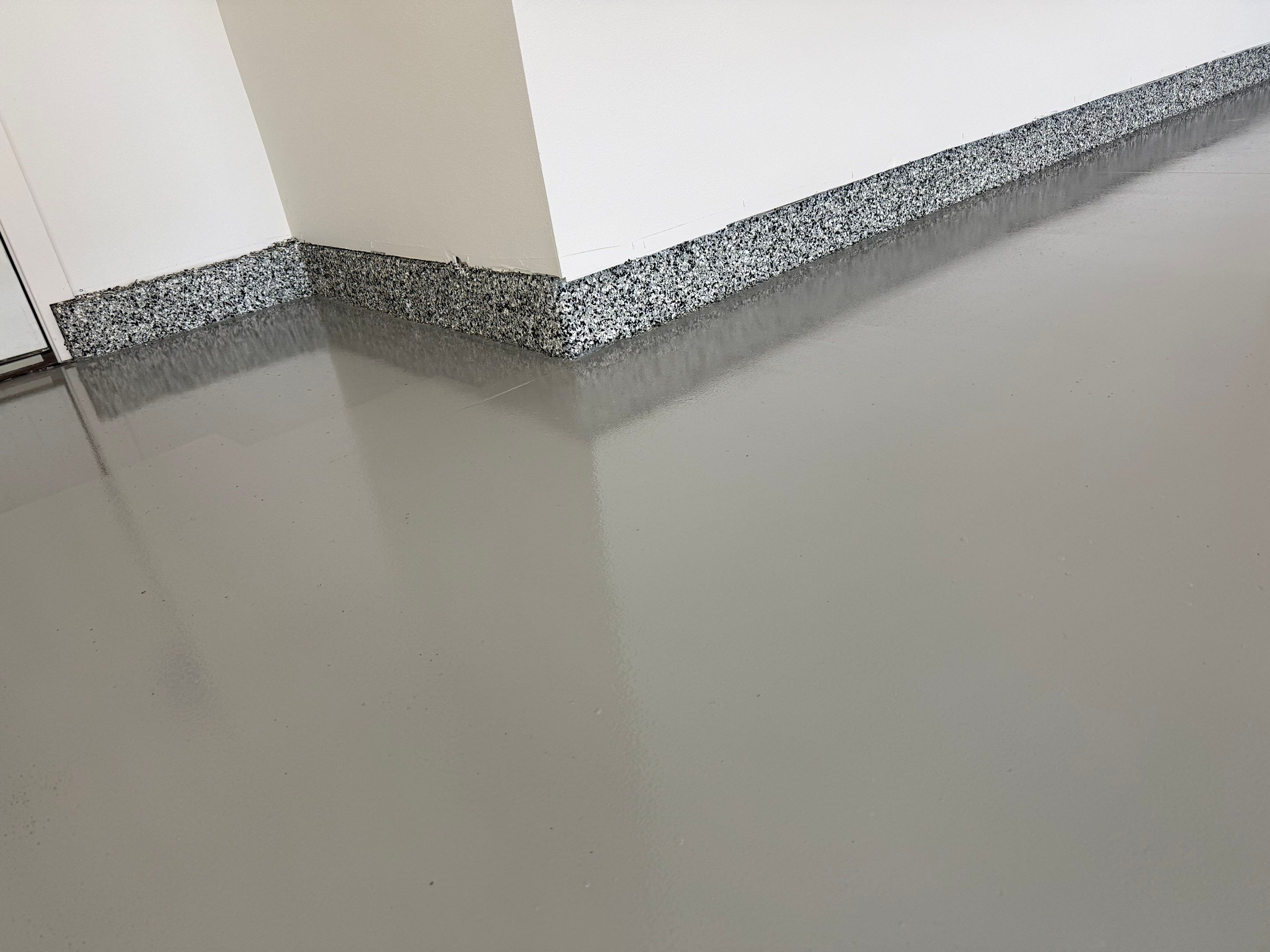 Multi-Car Garage Epoxy Floor Coating and Concrete Finishing in Sioux Falls by Select Painting, Coatings & Garage Cabinets