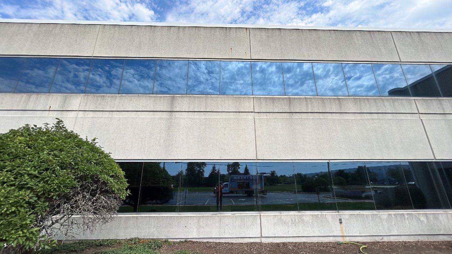 commercial pressure washing using Algaecide, soft wash soap by Northern Power Washing LLC.