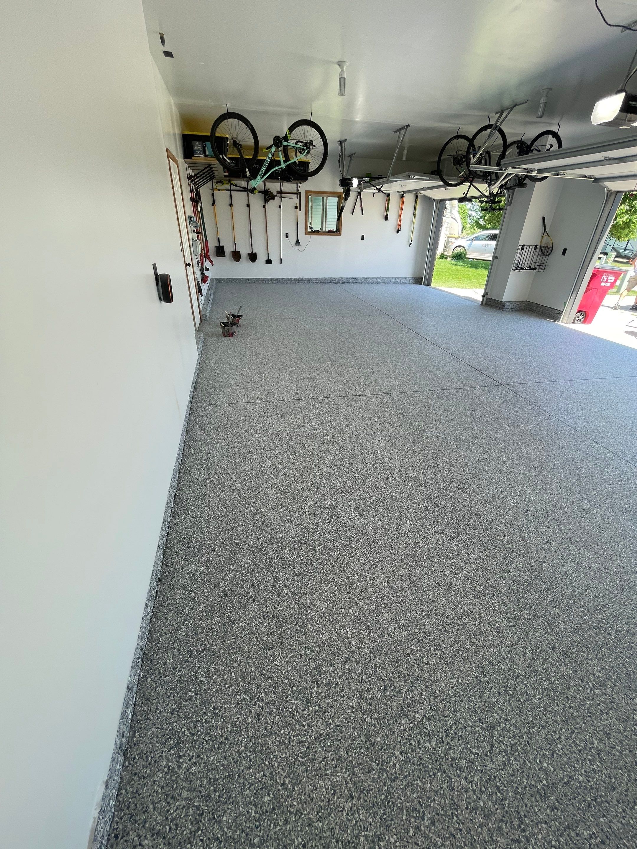 Tidal Wave Flake Garage Floor Installation in Sioux Falls by Select Painting, Coatings & Garage Cabinets