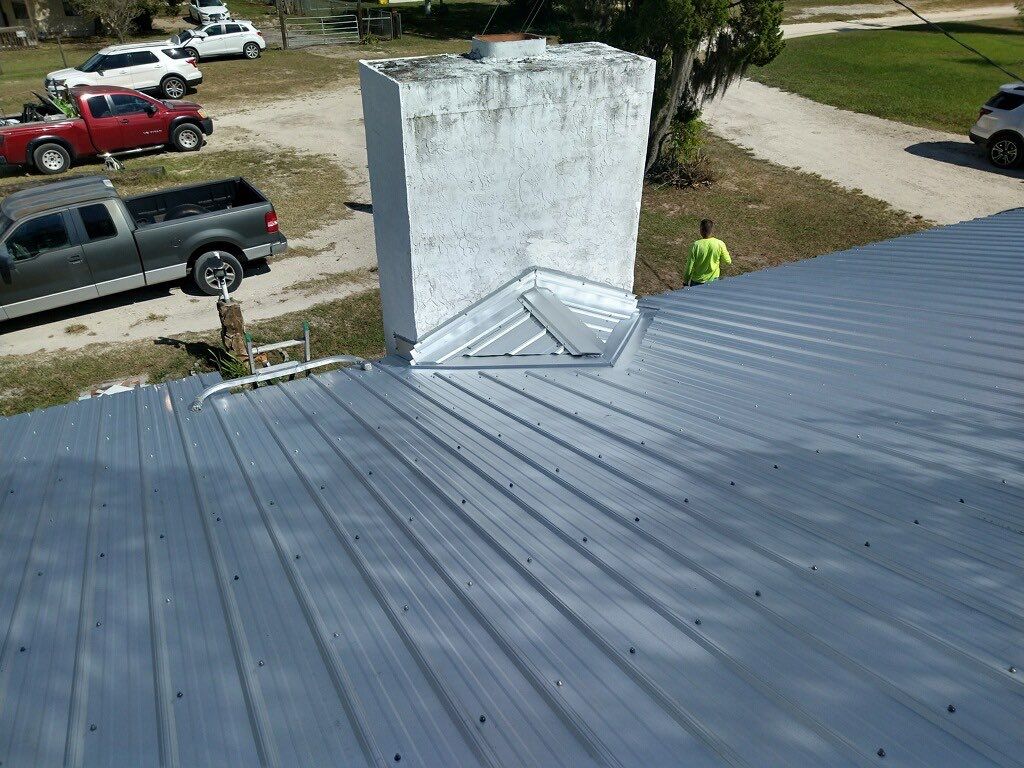 Residential Roofing Installation using 26 GA Rib Panel Galvalume by 1st Class Roofing, Inc.