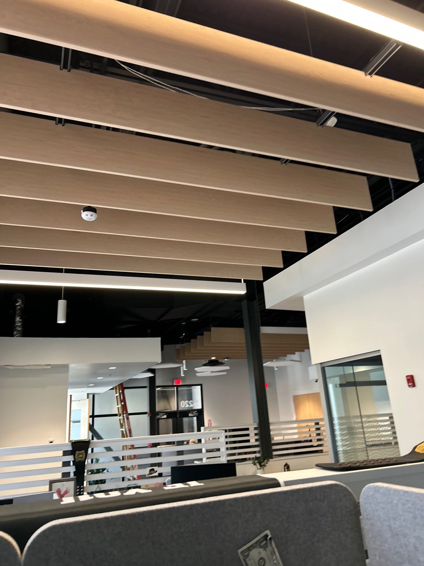 Office Remodel Featuring Acoustic Baffles and Professional Carpet Installation by CompanyCam Sales Demo