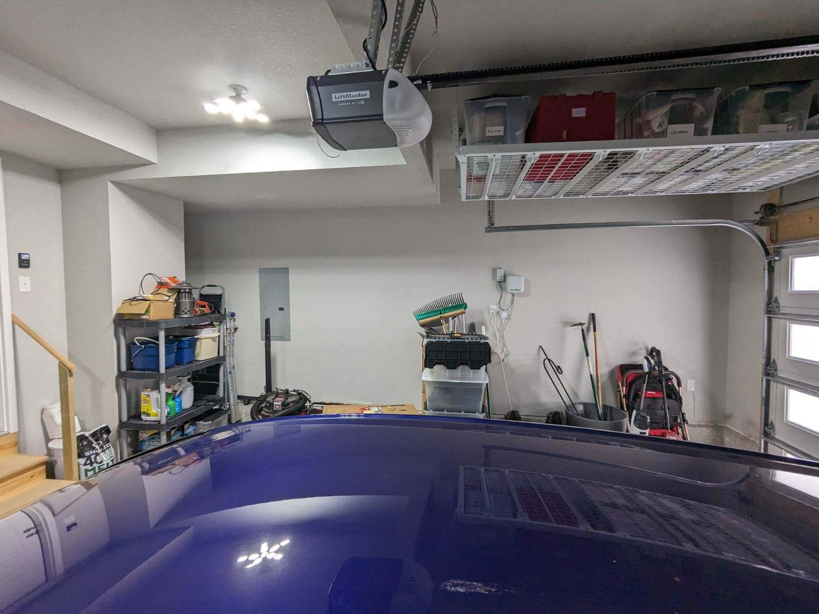 John H. maximized his storage with overhead racks and wall shelves by Banner Garage