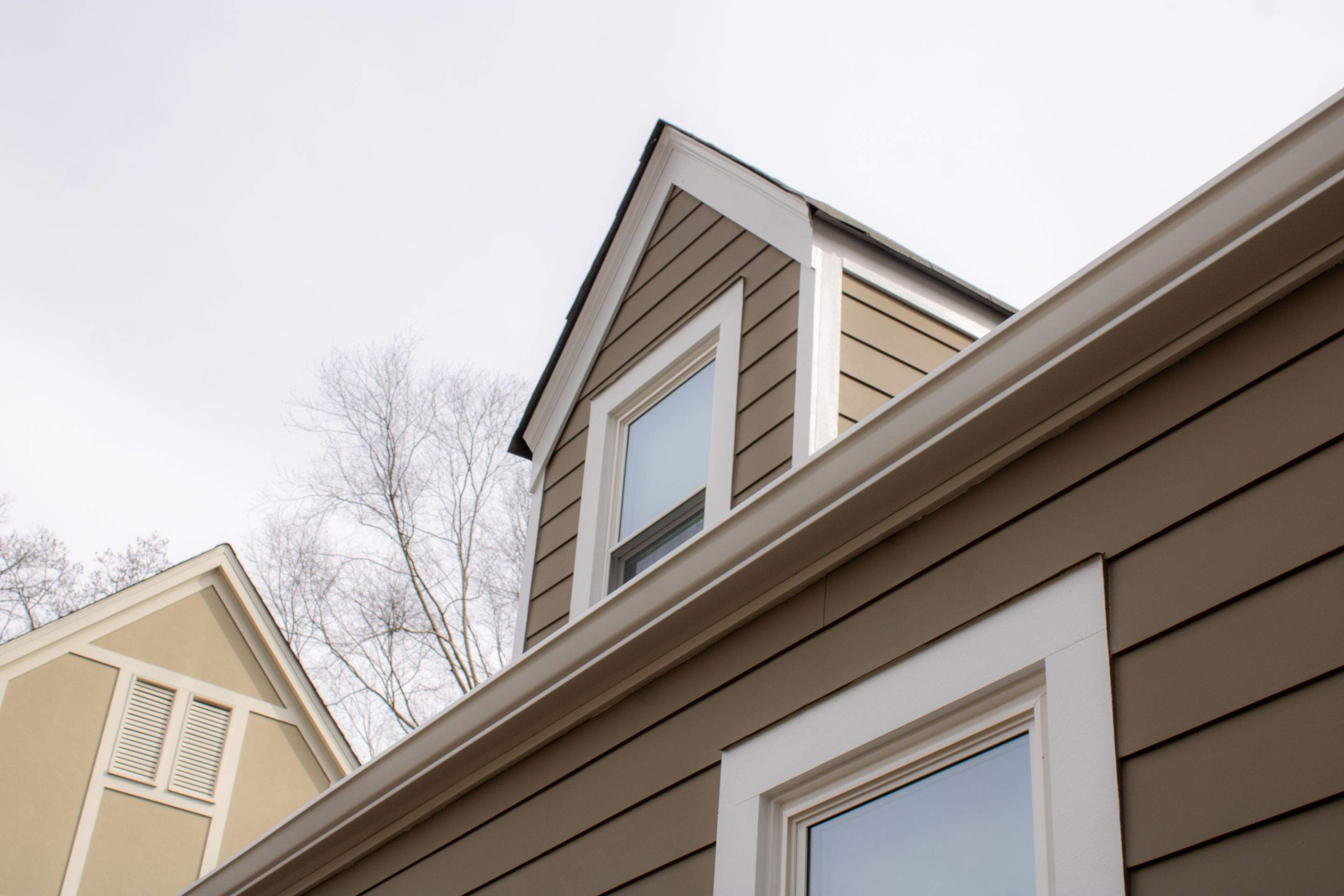 Full Siding Replacement, Deck Build, Exterior Paint, and Gutter Replacement  by Nelson Exteriors 